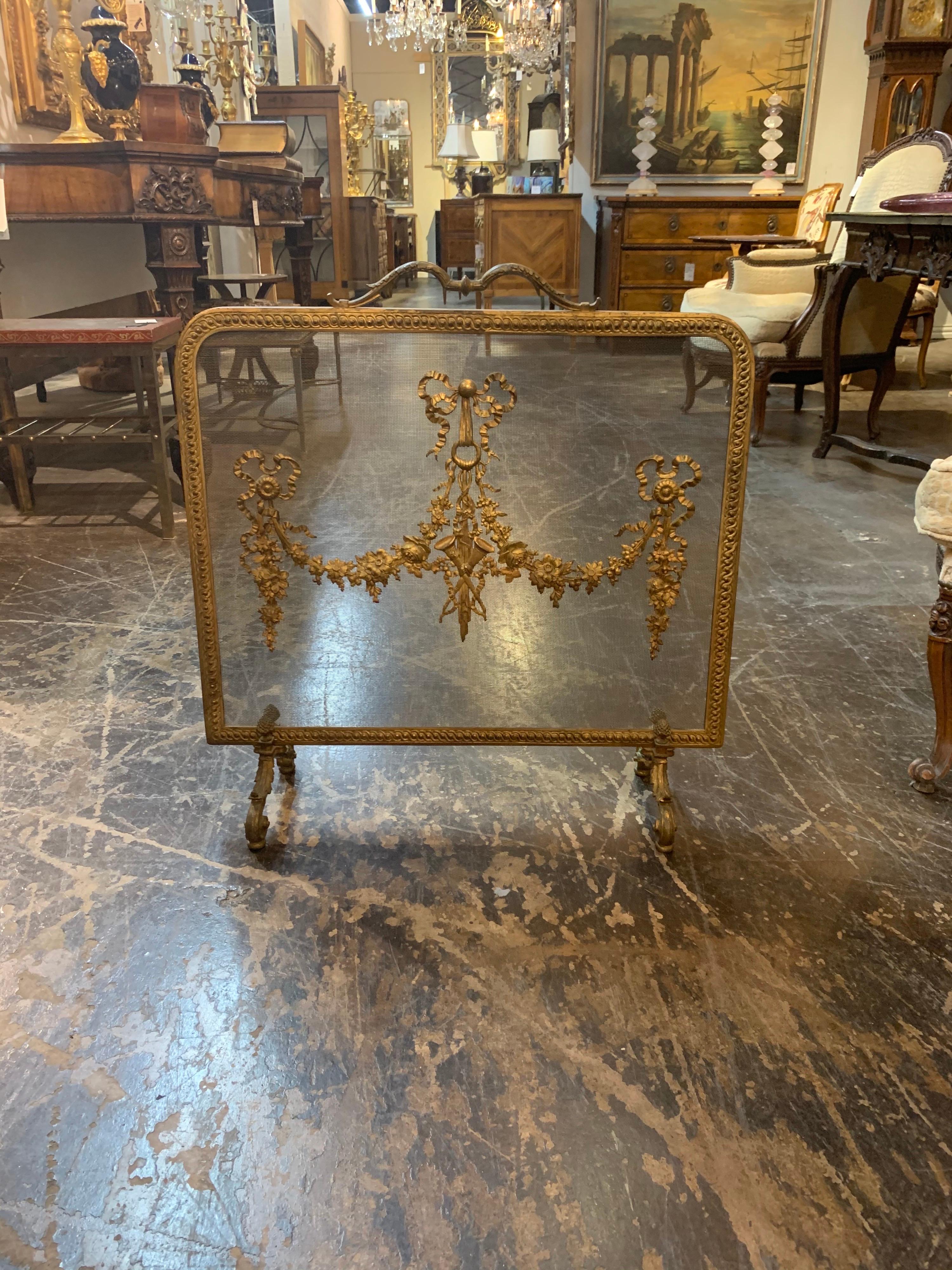 Beautiful 19th century French Louis XVI fireplace screen. Lovely decorative details including bows, floral images and musical instruments. An amazing piece of art!