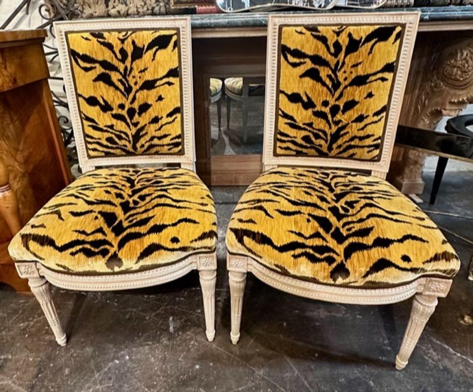 Lovely 19th century French Louis XVI style carved and bleached side chairs upholstered in a velvet fabric with a tiger pattern. Makes an impressive statement. Note these chairs are priced each.