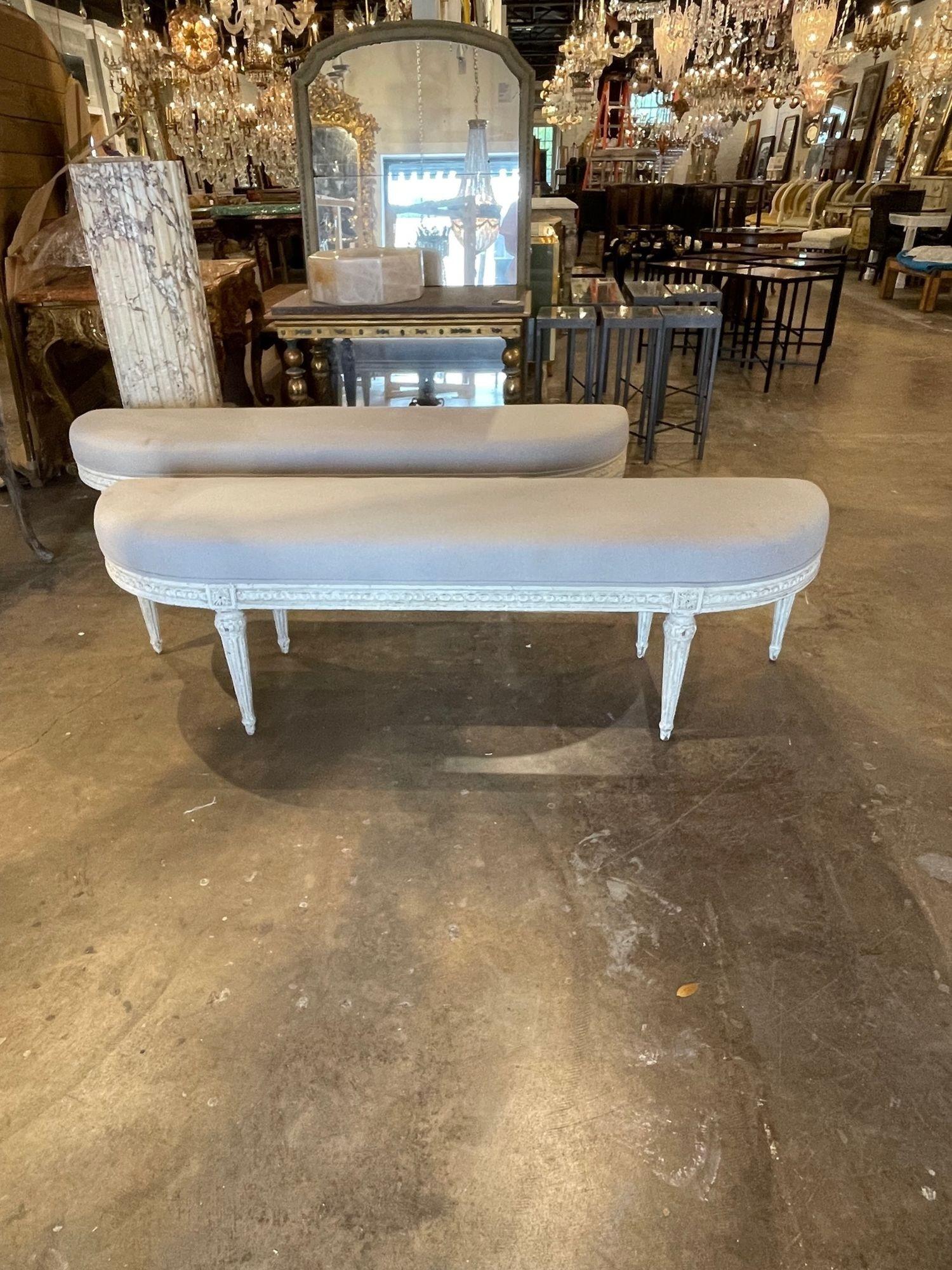 19th century French Louis XVI style carved and painted benches. Exceptional intricate carving and beautiful patina on these. Upholstered in a pretty beige linen fabric. Lovely! Note price listed is for 1