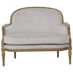 19th Century French Louis XVI Style Carved Giltwood and Pale Grey Suede Loveseat