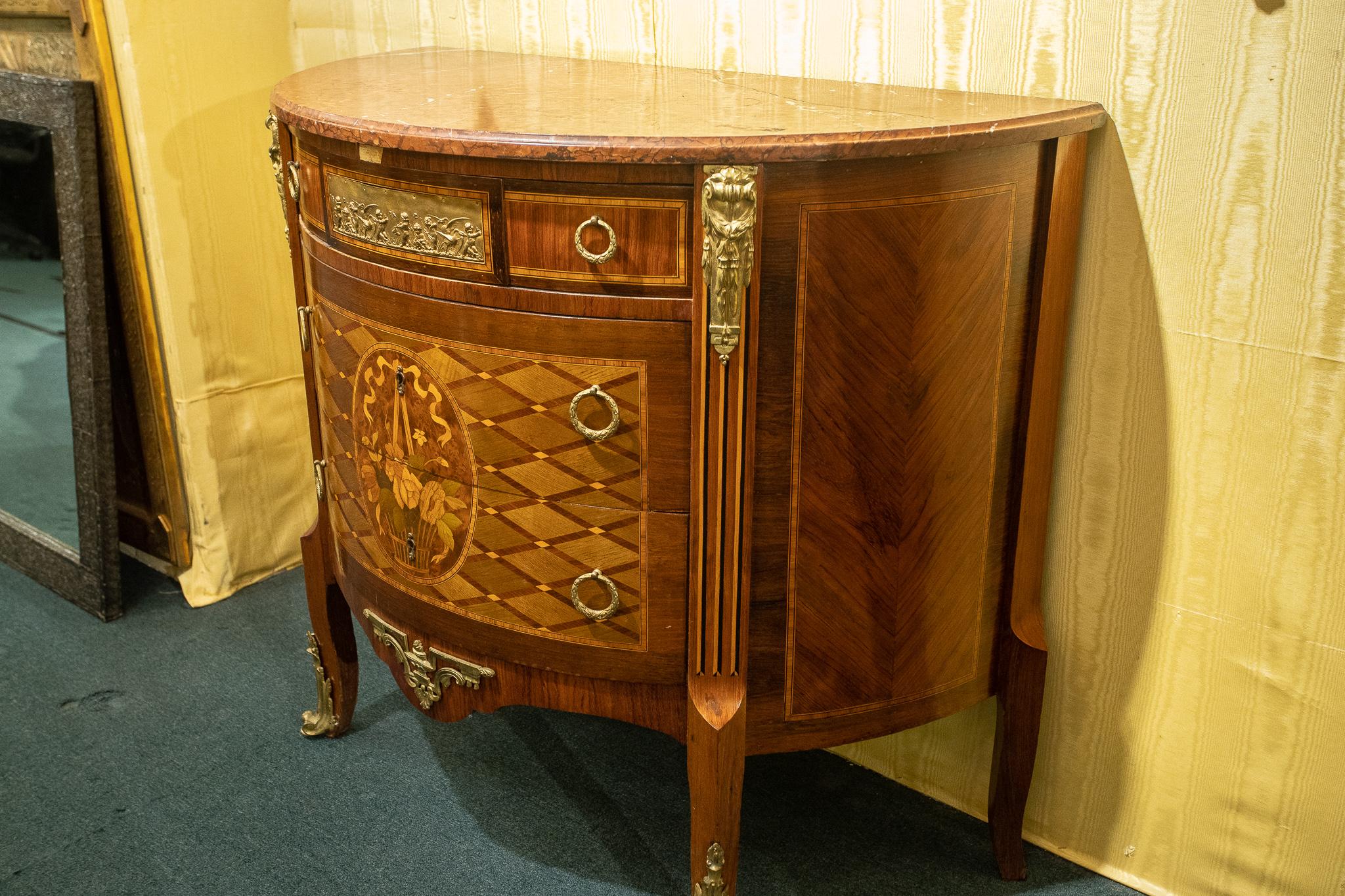 19th century French Louis XVI style demilune kingwood, marquetry and parquetry inlaid bronze-mounted marble-top commode.