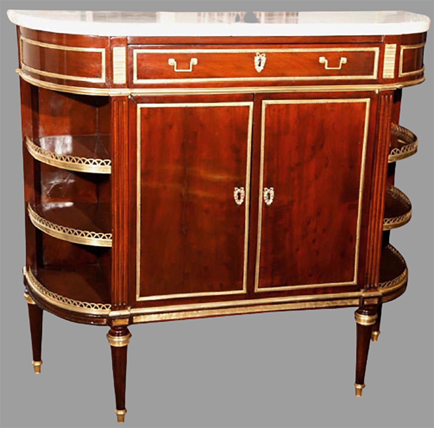 Late 19th century desserte server by Maison Jansen. Finest bronze mounts adorn this one of a kind flame mahogany desserte stand. The top white Carrara marble supported by a lower case having a center drawer over two doors flanked by a set of three