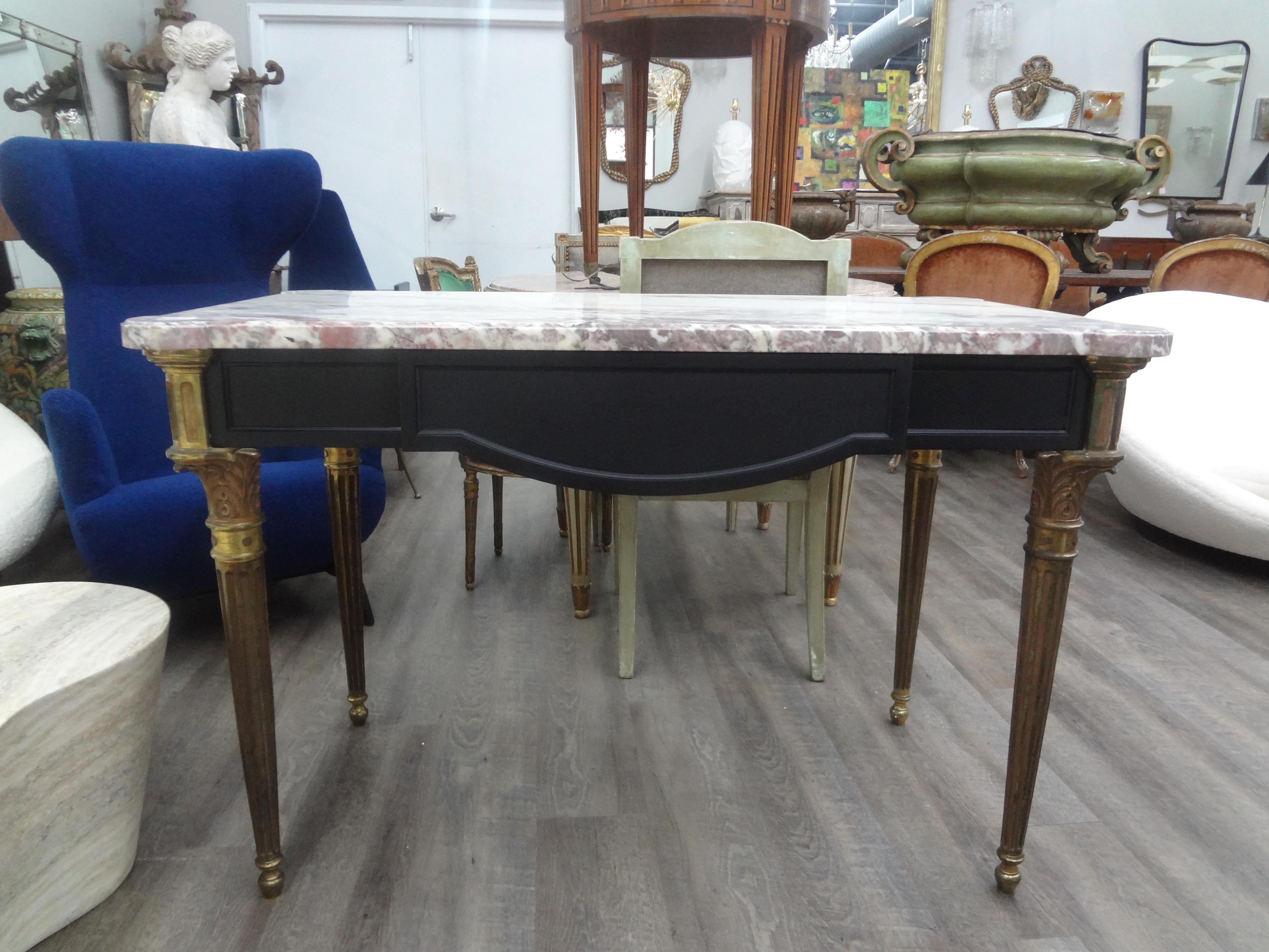 19th Century French Louis XVI Style Ebonized Desk.
Outstanding 19th century French Louis XVI style desk, writing table, bureau plat or center table with a single drawer, solid bronze legs and the original sculpted marble top.
This stunning desk