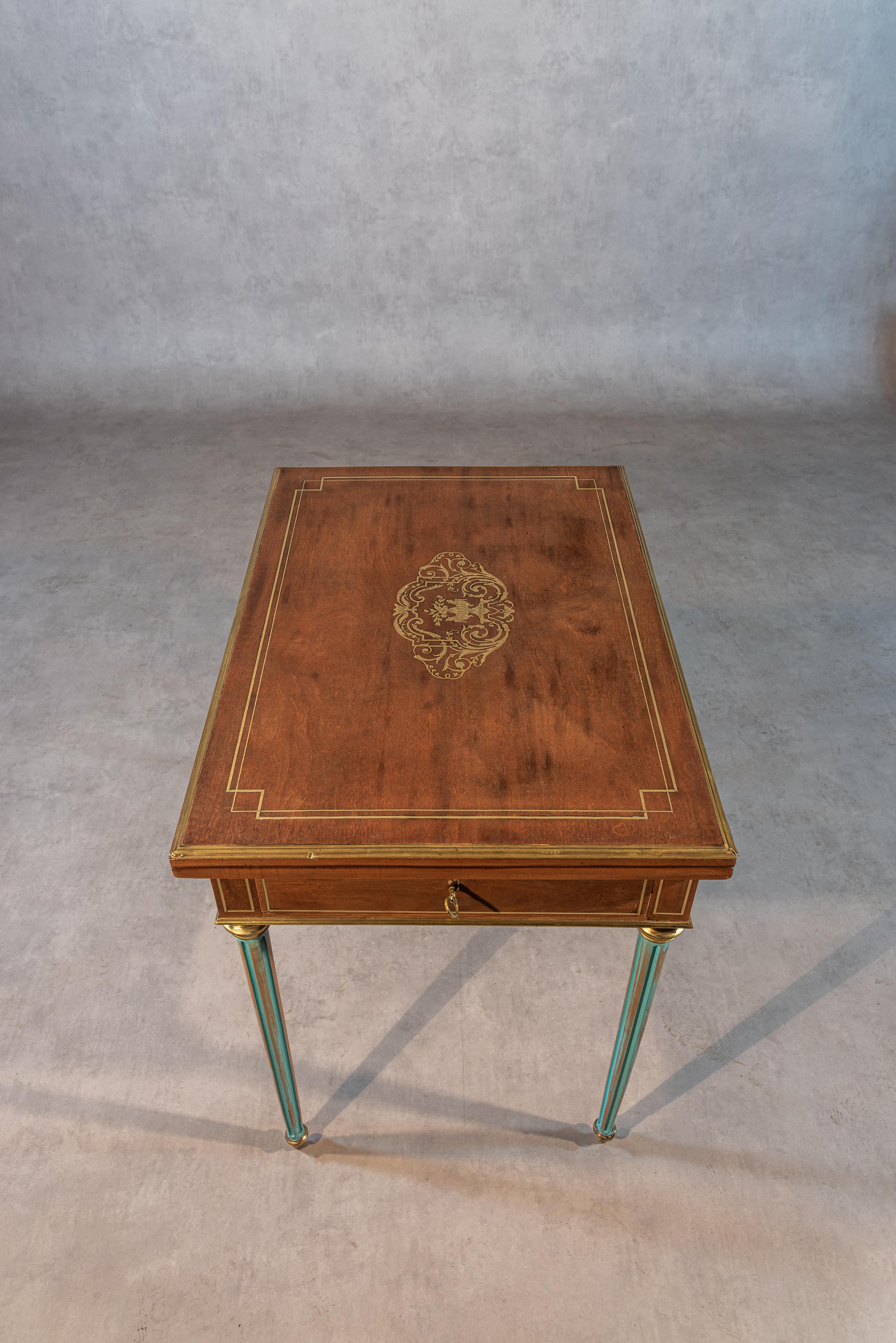 This 19th century French Louis XVI Style Game Table is a stunning piece that seamlessly combines elegance, functionality, and versatility. Crafted in the style of Louis XVI, it showcases exquisite craftsmanship and attention to detail. The table