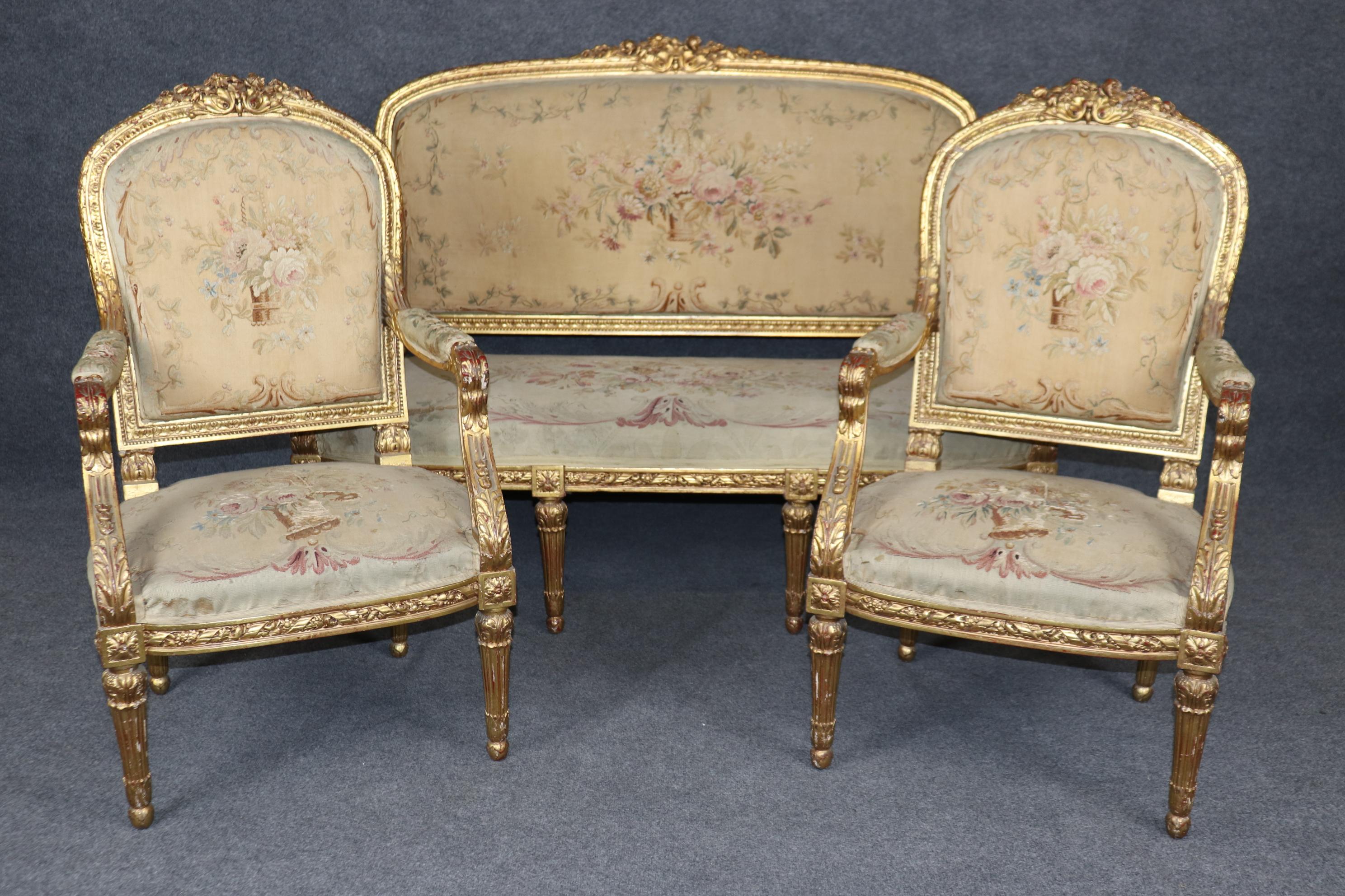 Dimensions - (Settee) H: 44 3/4in W: 58 1/2in D: 30in SH: 17 3/4in
Arm Chairs - H: 42 1/2in W: 24in D: 24in SH: 17in

This 19th Century French Louis XVI Style Gilt Wood Aubusson Parlor Set is truly spectacular and whispers tales of a bygone era!