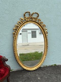 19th Century French Louis XVI Style Gilt Wood Oval Mirror with Knotted Ribbon