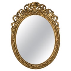 19th Century French Louis XVI Style Gilt Wood Oval Mirror with Knotted Ribbon