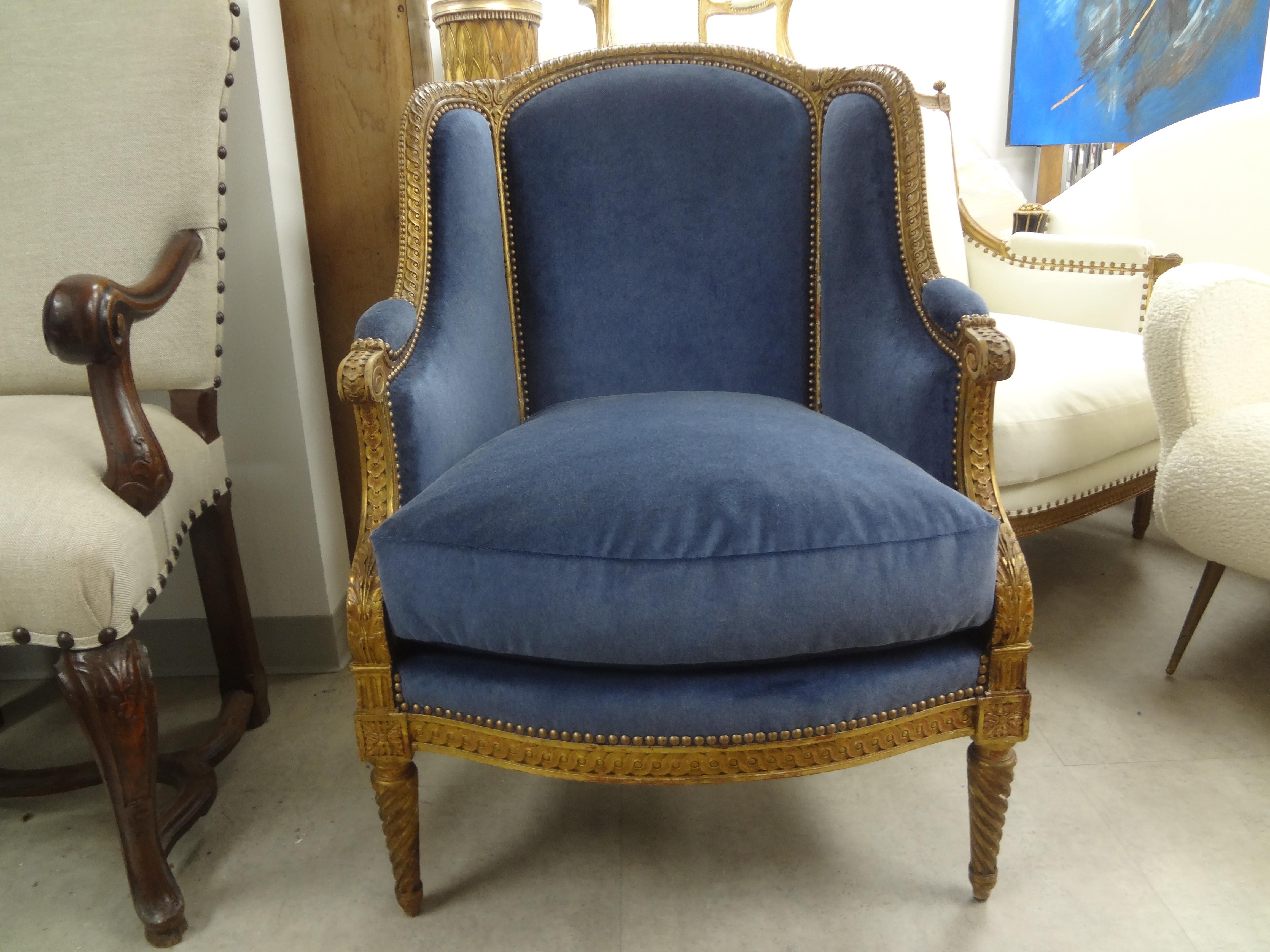 Unusual 19th century French Louis XVI style giltwood bergère from Paris. This antique French giltwood bergère has beautiful twisted legs in both front and back and is large and comfortable. This French Napoleon III gilt wood chair has been