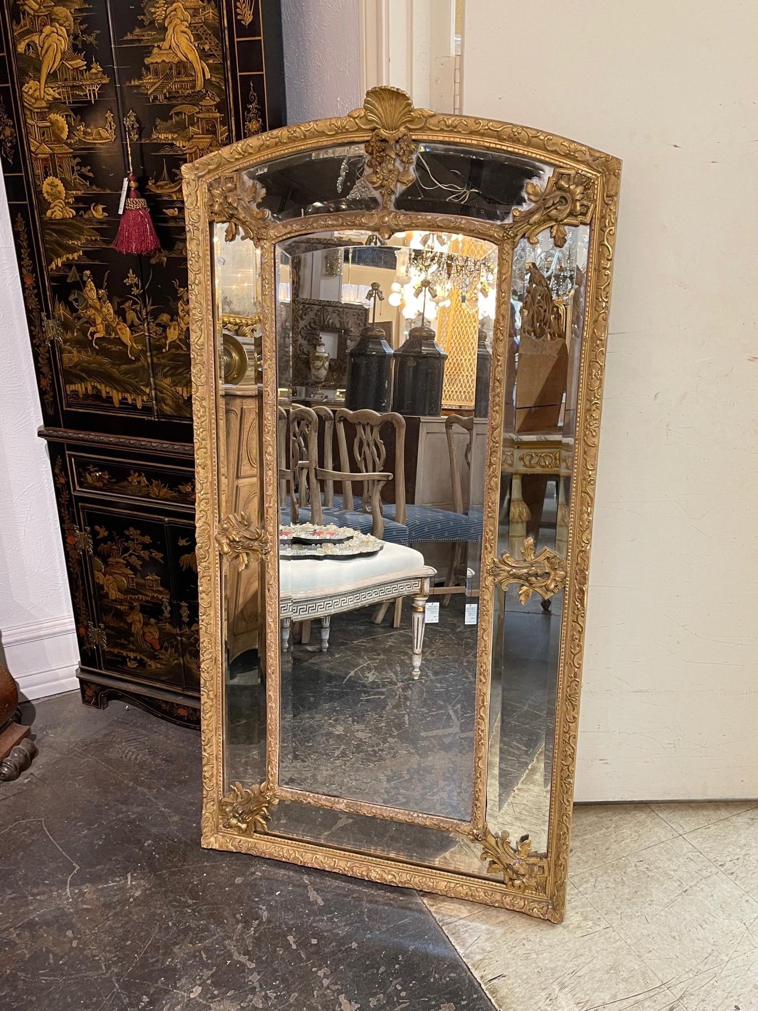 Elegant 19th century French Louis XVI style giltwood cushion mirror with glass panels. Very fine carving including a shell at the top. Stunning!!