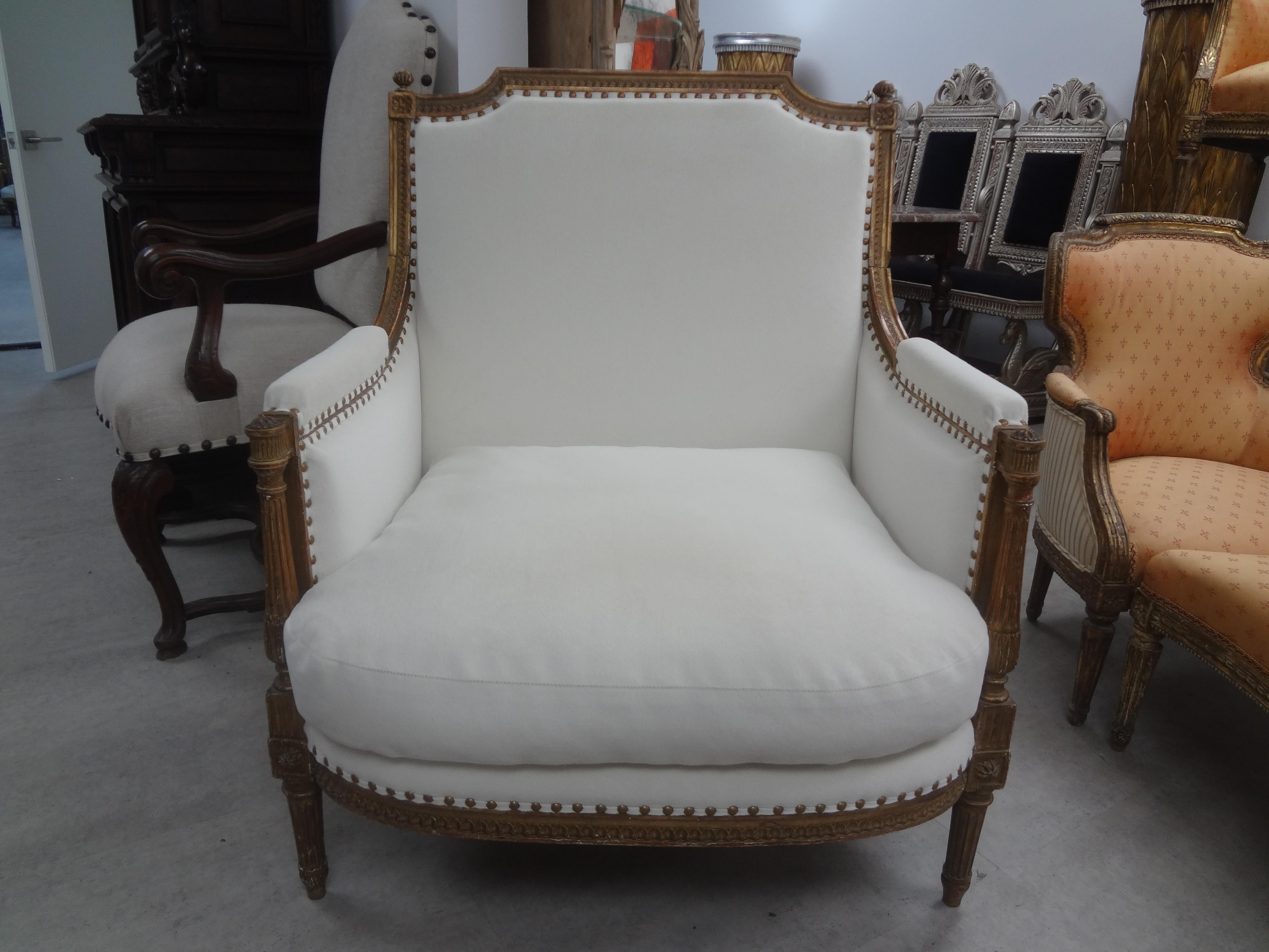 19th century French Louis XVI style giltwood marquise or bergere.
This stunning antique French Louis XVI style gilt wood marquise, loveseat, bergere or chair is most comfortable. It has been newly upholstered with a down cushion in a plush neutral
