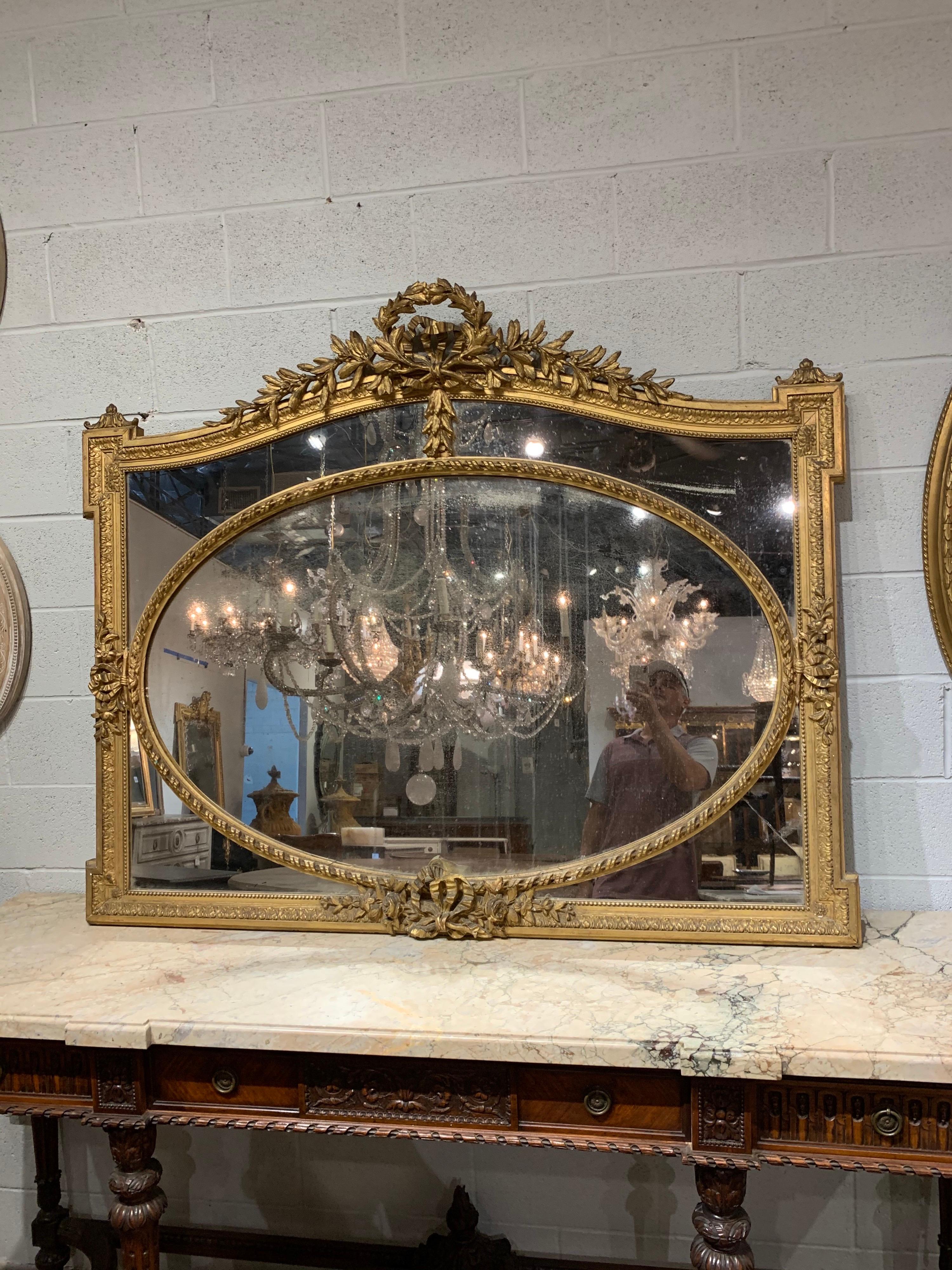 Beautiful decorative 19th century French Louis XVI style giltwood mirror. Outstanding carving and gilt on this piece. A true work of art that is sure to impress!