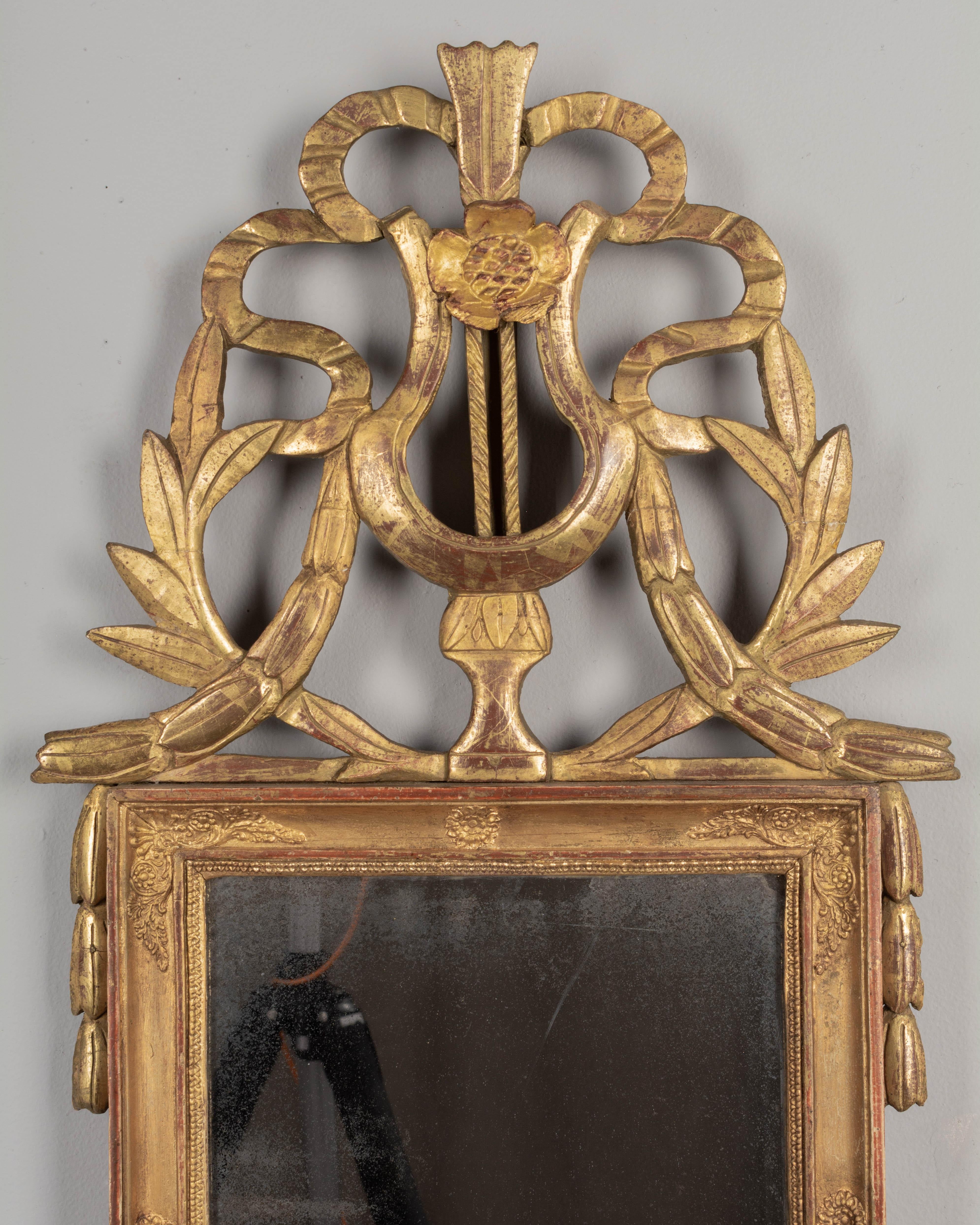Hand-Carved 19th Century French Louis XVI Style Giltwood Mirror For Sale