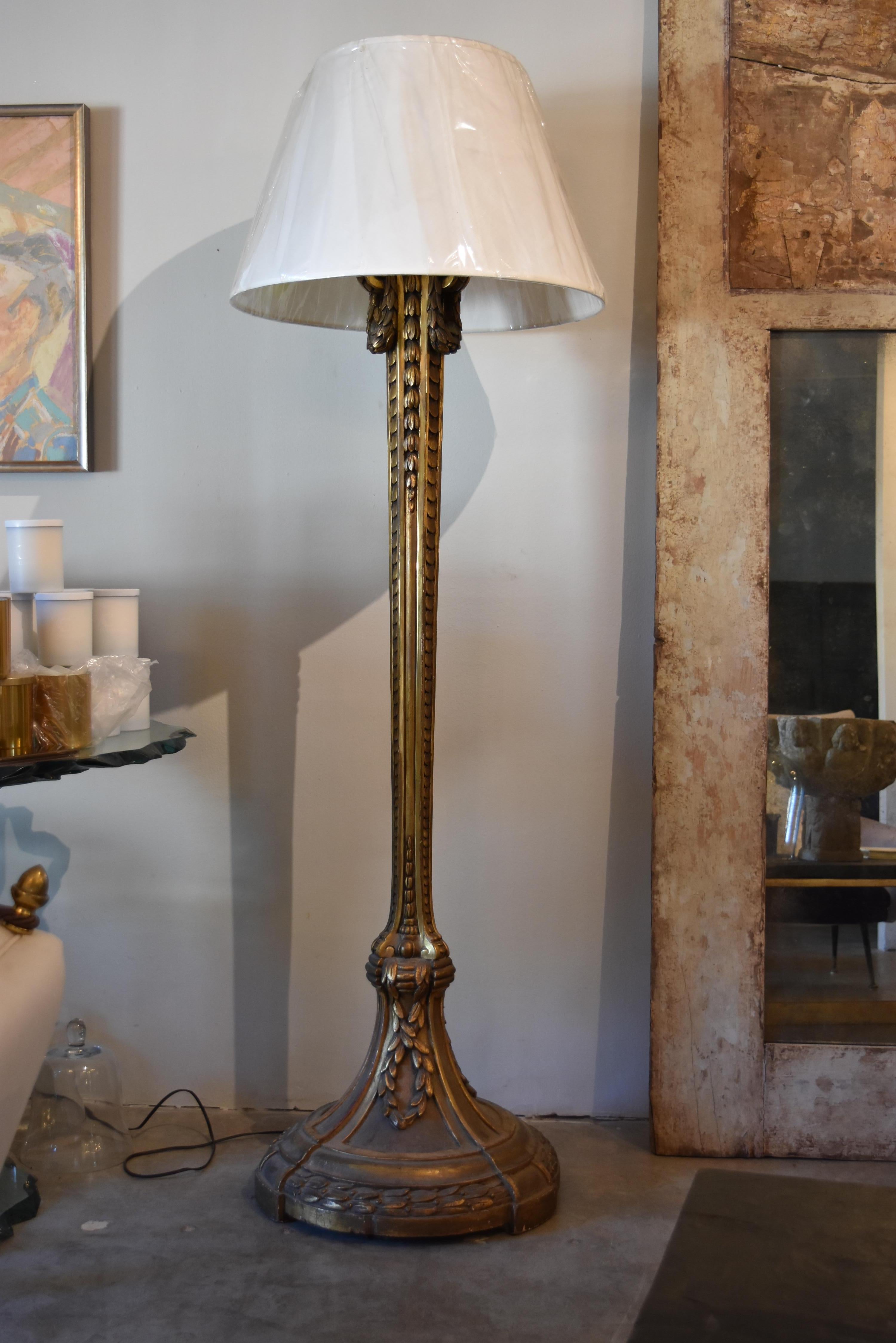 This was an elegant French gold gilded candle stand lamp from the 19th c.  It now is newly electrified as a floor lamp. 
