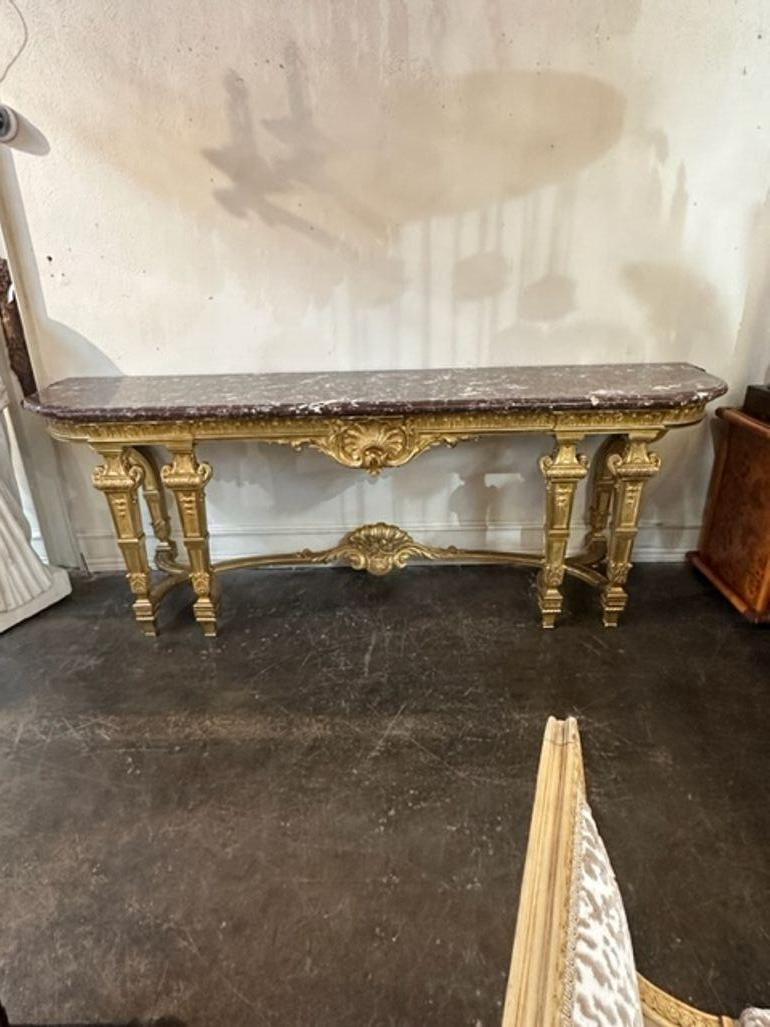 Exceptional 19th century French Louis XVI style large scale giltwood console. Very fine carving with topped with a gorgeous piece of marble. Very impressive!!