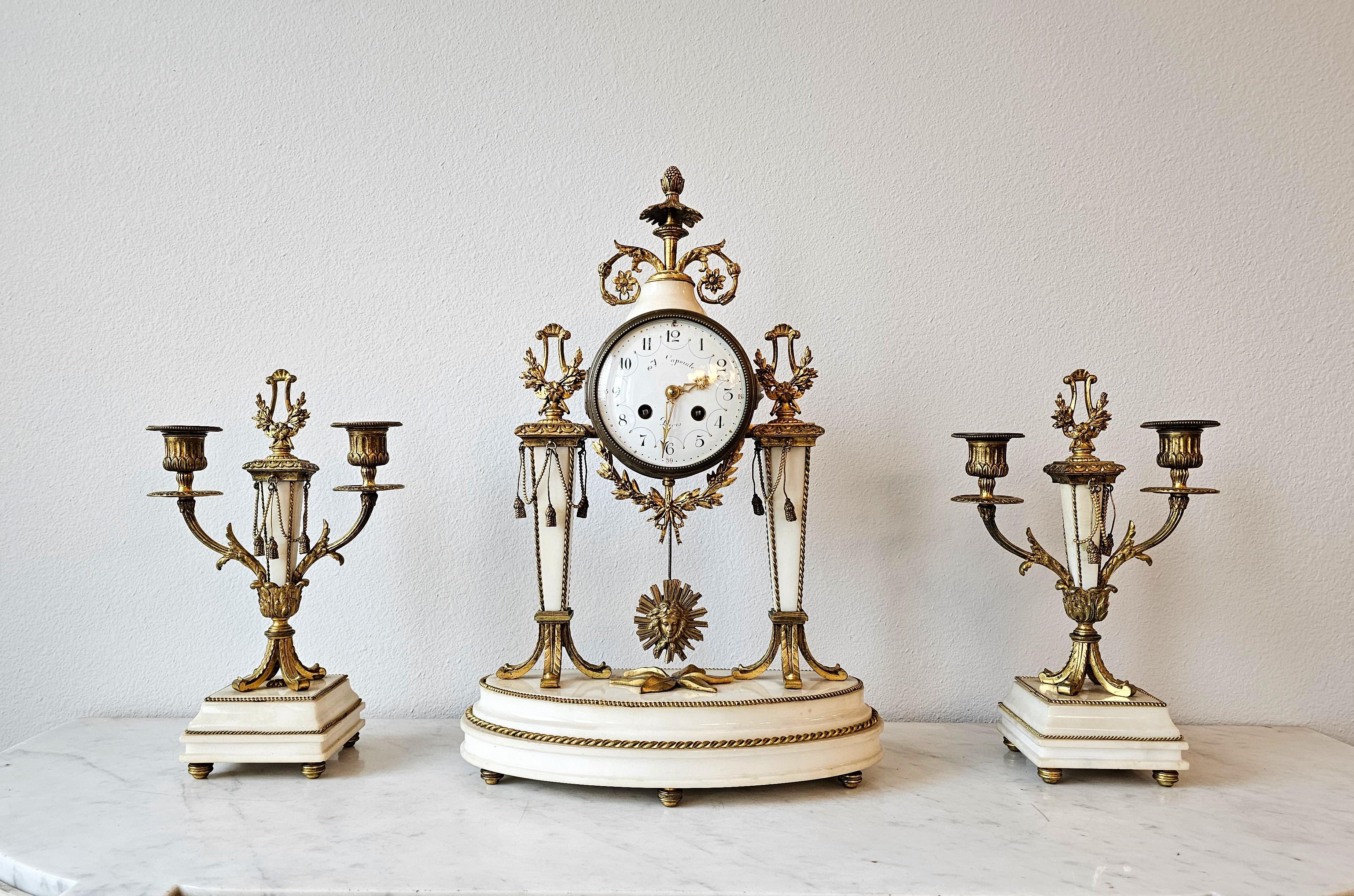 A luxurious French Louis XVI style gilt bronze ormolu and alabaster (onyx-marble) three piece mantle clock and garniture set, possibly attributed to Raingo Freres.

The fine quality antique originating in France in the late 19th century, exquisite