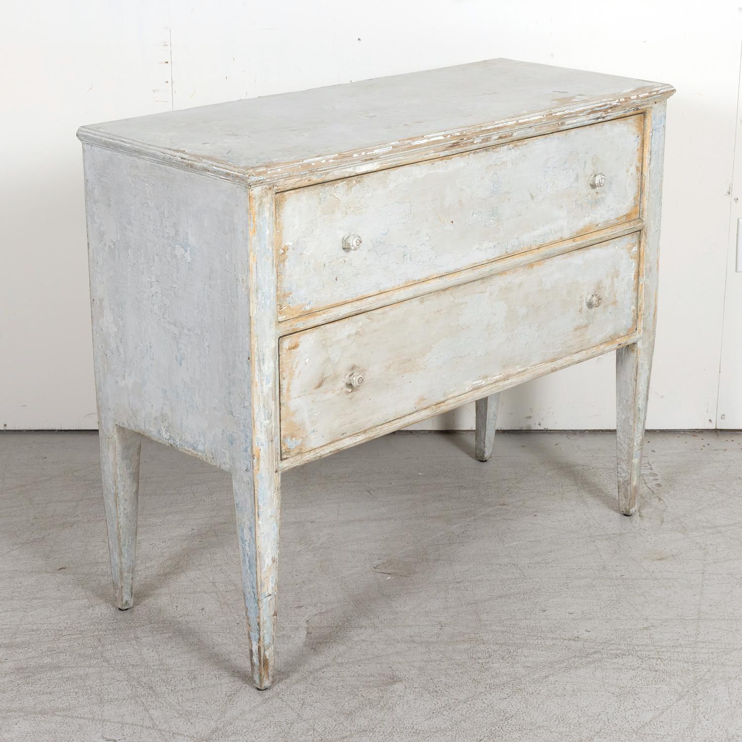 A 19th century French Louis XVI style commode sauteuse handcrafted in oak with a painted finish, circa 1880s. Painted in France, this handsome bluish gray colored chest of drawers features clean lines and a wonderful patinated finish. Also referred