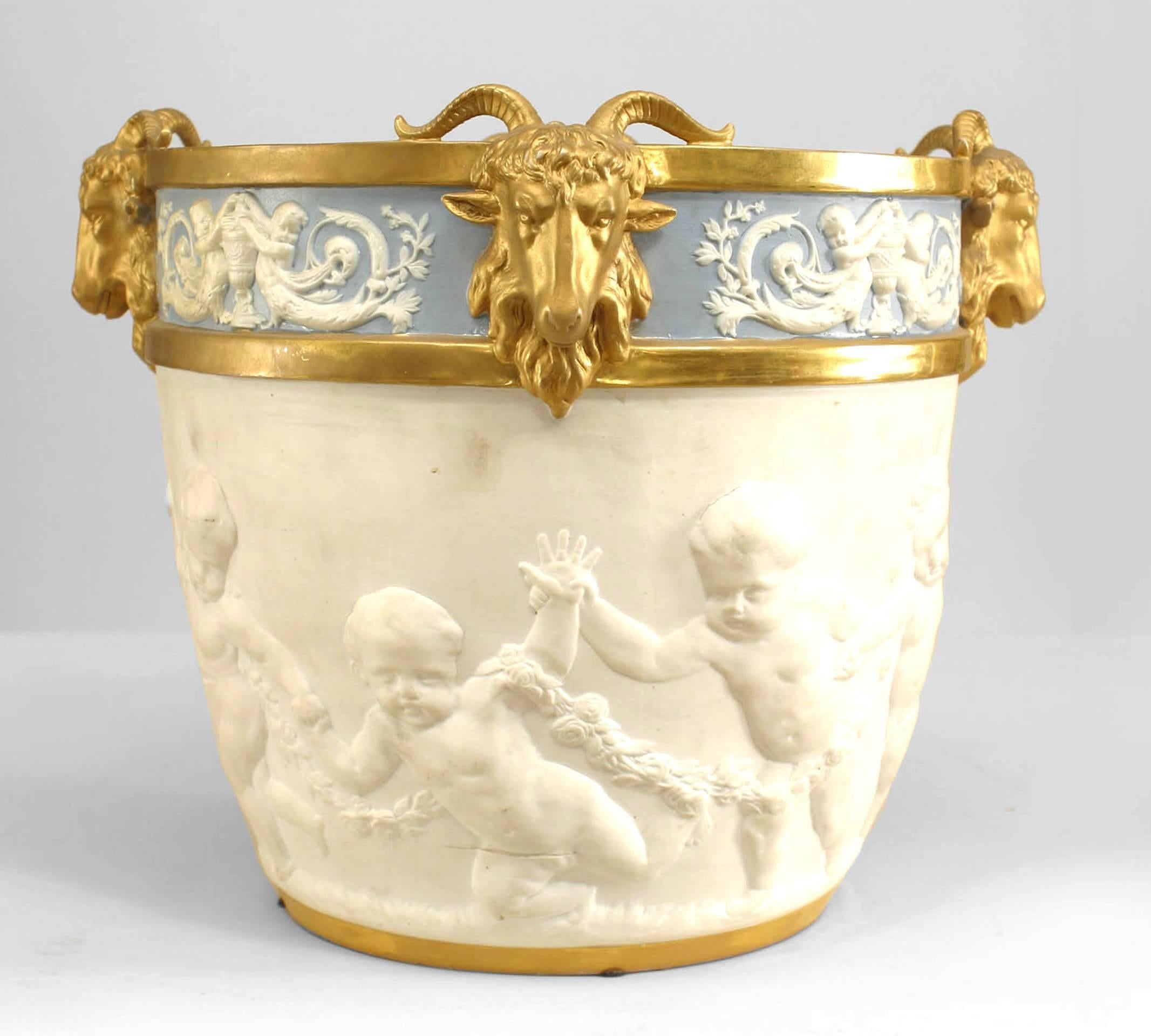 Pair of French Louis XVI-style (19th Century) blue and white Sevres (Samson) porcelain jardinieres with 4 gilt ram heads (Estate of Evelyn Walsh McLean, Washington, D.C.)
