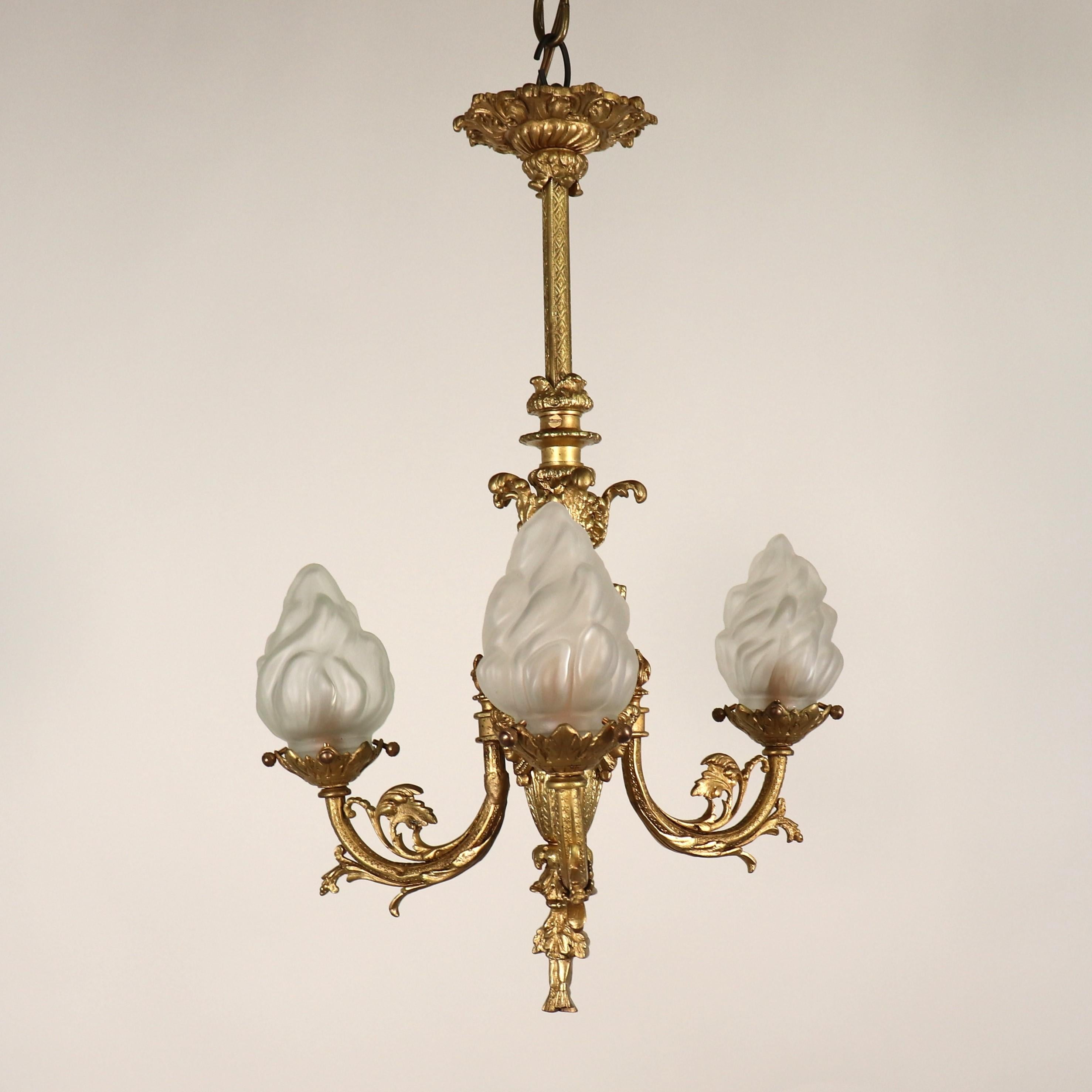 his exquisitely made, Circa 1880, French, Louis XVI style, yellow gold gilt chandelier is a masterpiece of metalwork full of neoclassical motifs that carry multi-layered symbolism that speaks to the aesthetic, intellectual, and cultural tapestry of