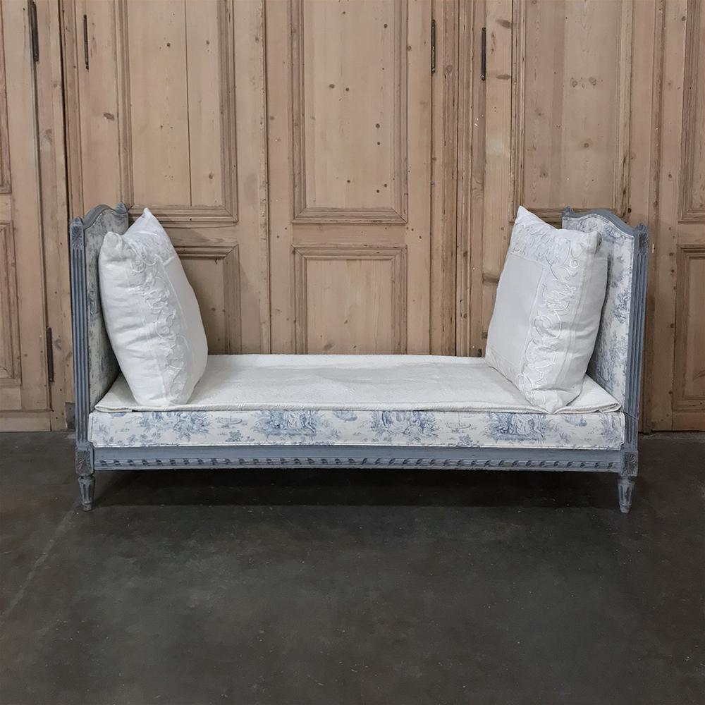 19th century French Louis XVI Upholstered Day Bed makes a great choice as a sofa, as guest room accommodations, or simply as a place to relax after a hard day's work. Finely carved framework in the neoclassical genre is accentuated by the toile
