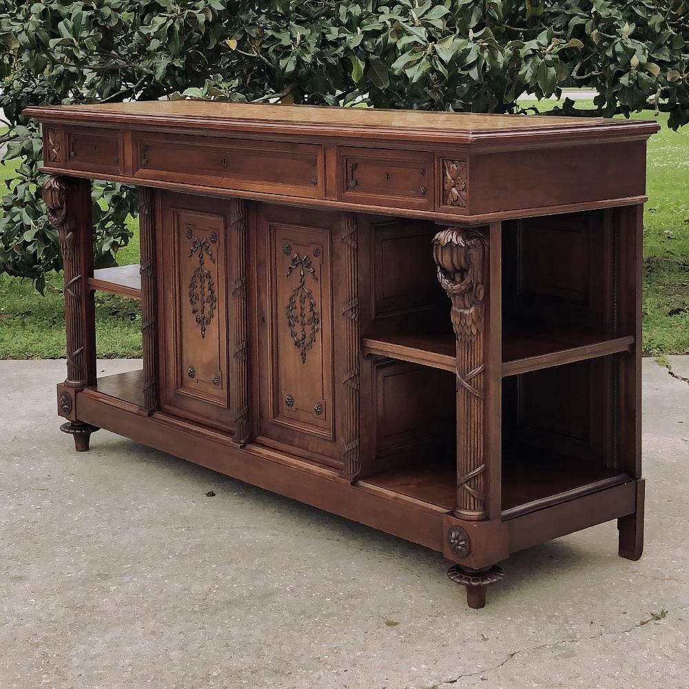 19th century French Louis XVI walnut marble top buffet represents the stately elegance of the style, with architectural interest inspired by ancient Greek and Roman designs. Rendered from sumptuous French walnut, it features an exquisite intertwined