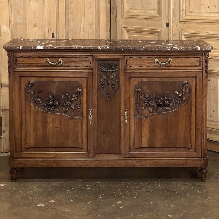 19th century French Louis XVI walnut marble top buffet is a definitively French expression of the neoclassic revival of the styles birthed during the ancient Greek and Roman times that continues to remain popular thousands of years later! This