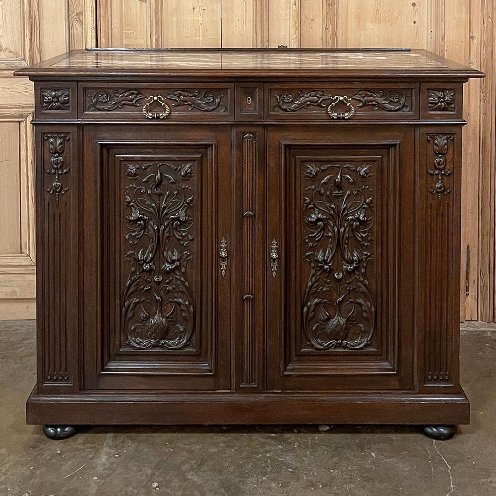 19th century French Louis XVI walnut marble top buffet is a marvelous example of the furniture maker's craft! Stately, tailored lines are framed by bold molding above and below, just over the bun feet. In between, evidence of a master wood sculptor