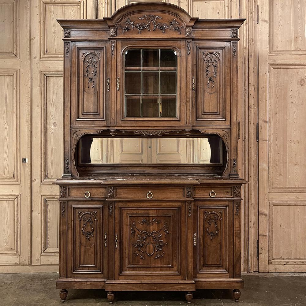 19th Century French Louis XVI Walnut Marble Top China Buffet is a masterpiece of the cabinetmaker's art!  Meticulously hand-crafted from select French walnut, it features a stately, tailored architecture that is inspired by the classic styles of