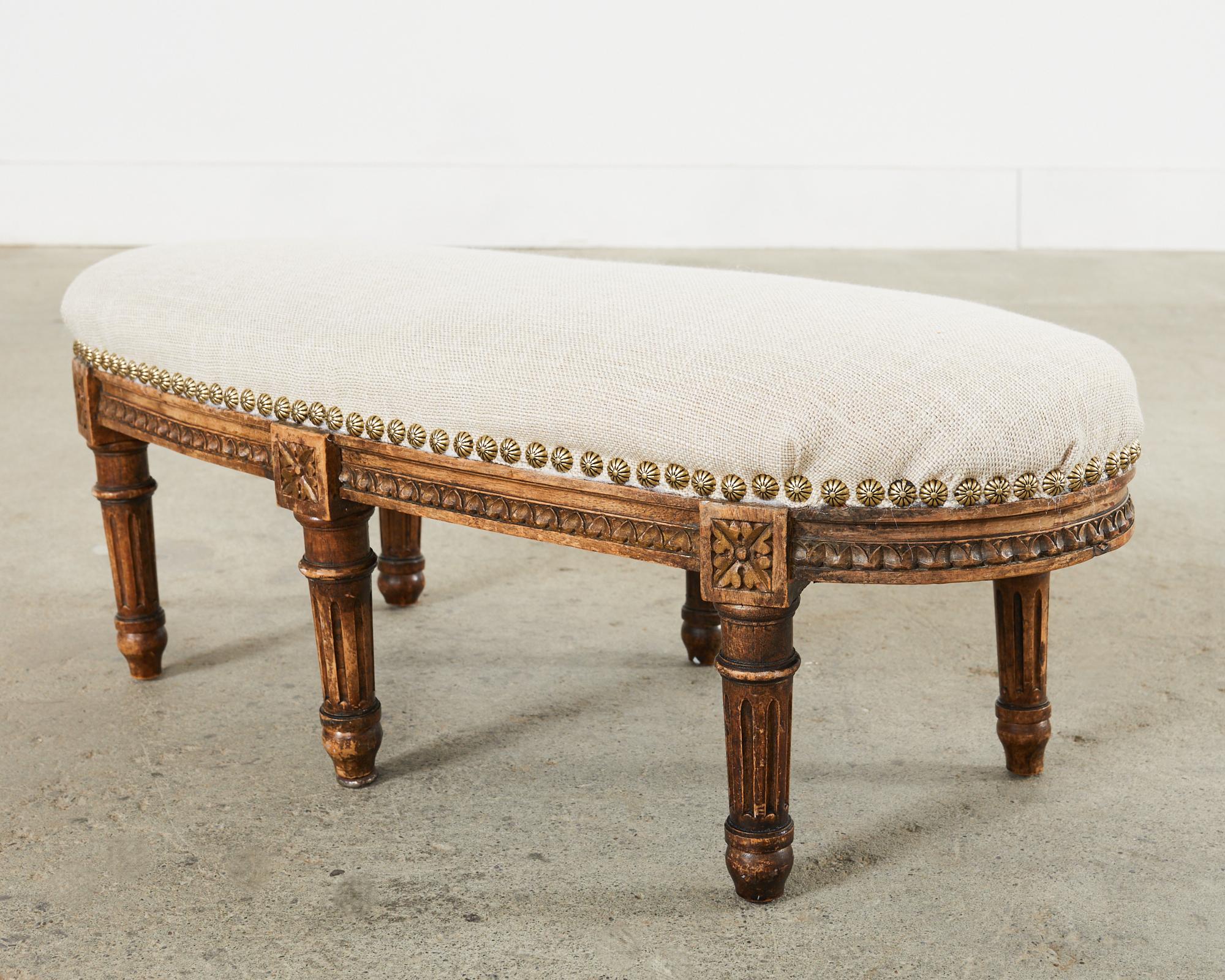 19th Century French Louis XVI Walnut Six Leg Oval Footstool In Distressed Condition For Sale In Rio Vista, CA