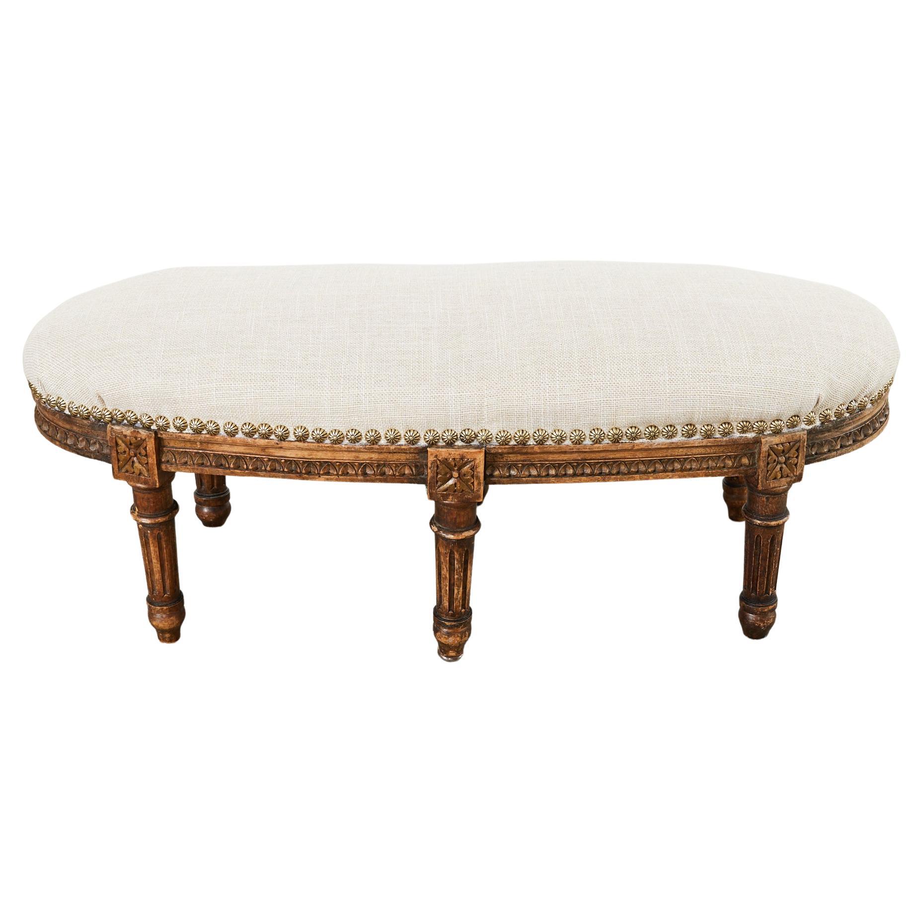 19th Century French Louis XVI Walnut Six Leg Oval Footstool For Sale
