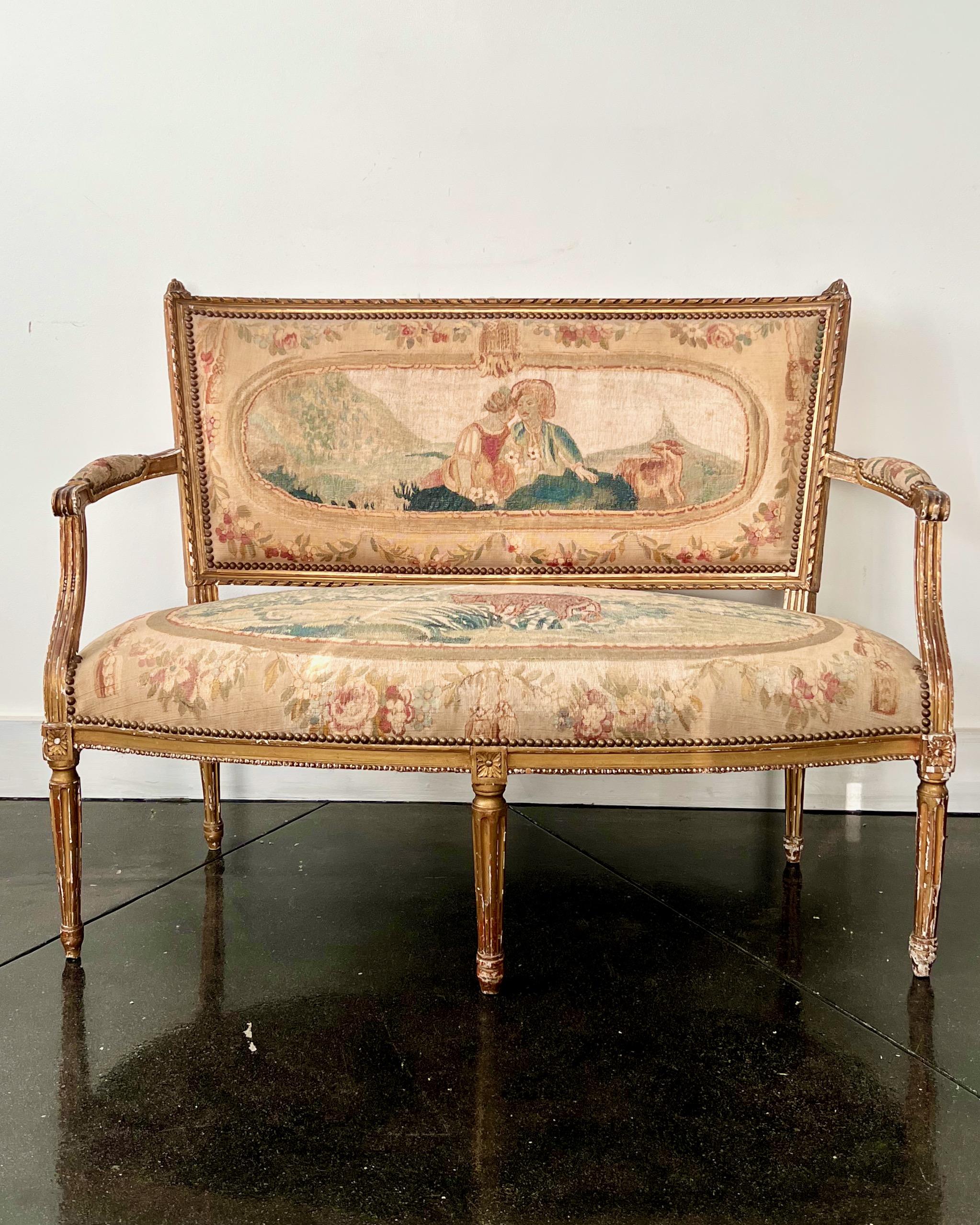 Charming small 19th century gilt wood Settee richly upholstered in hand-woven Aubusson tapestry.