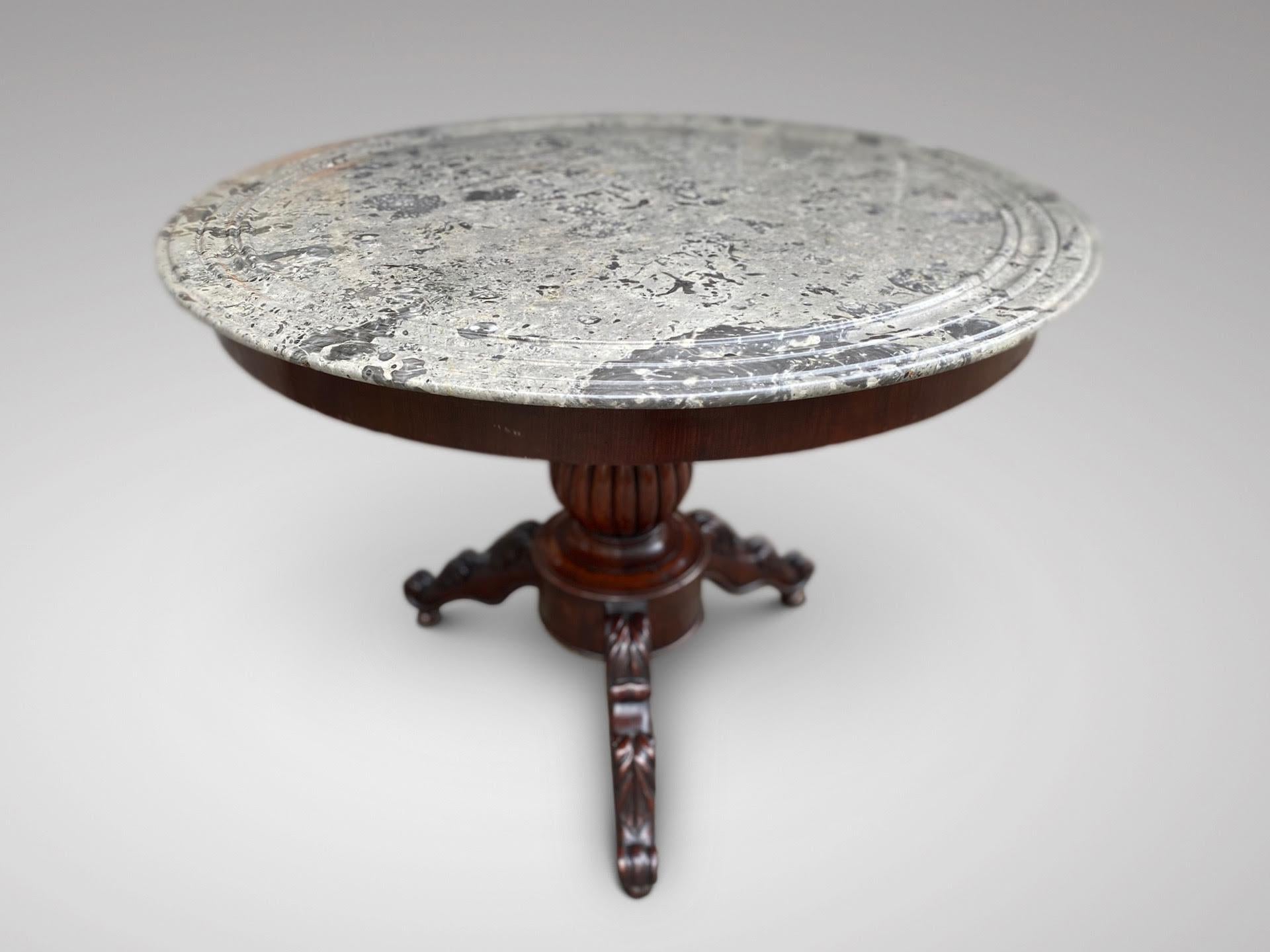 An attractive 19th century French mahogany circular guéridon marble top centre table. Perfect condition round marble top with moulded edge over a turned reeded baluster and raised on tripod base ending on carved legs and ball feet. An original and