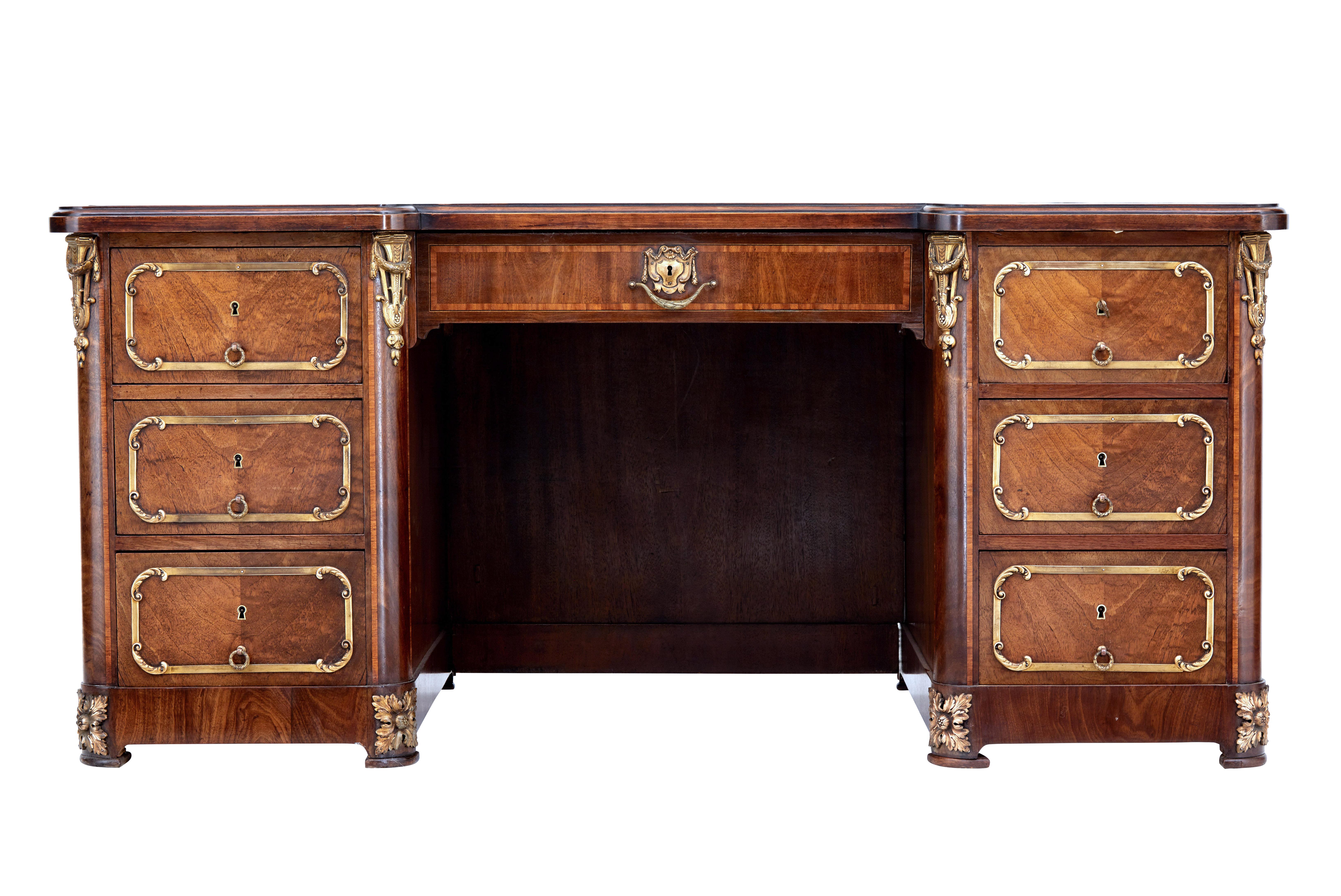 Beautiful French empire mahogany desk, circa 1890.

As typical with desks of this period and size it was made to be taken apart, comprising of 2 pedestals, panel to foot well, front drawer and separate top.

Top surface with original gold tooled