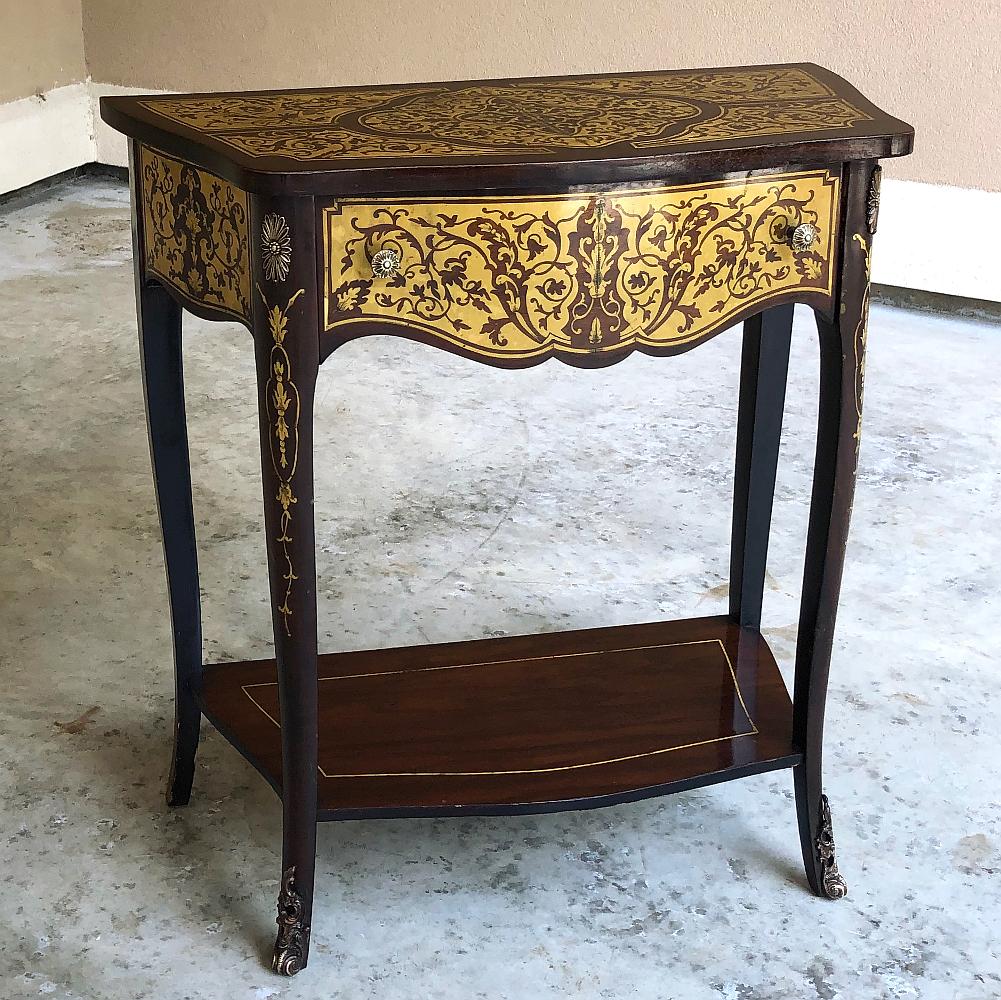 19th Century French Mahogany Intricately Inlaid with Brass Console is an unusual find, indeed!  Exhibiting a subtle expression of the Louis XV - or Rococo - style, it features a gracefully bowed front with serpentine sides, an upper drawer and lower