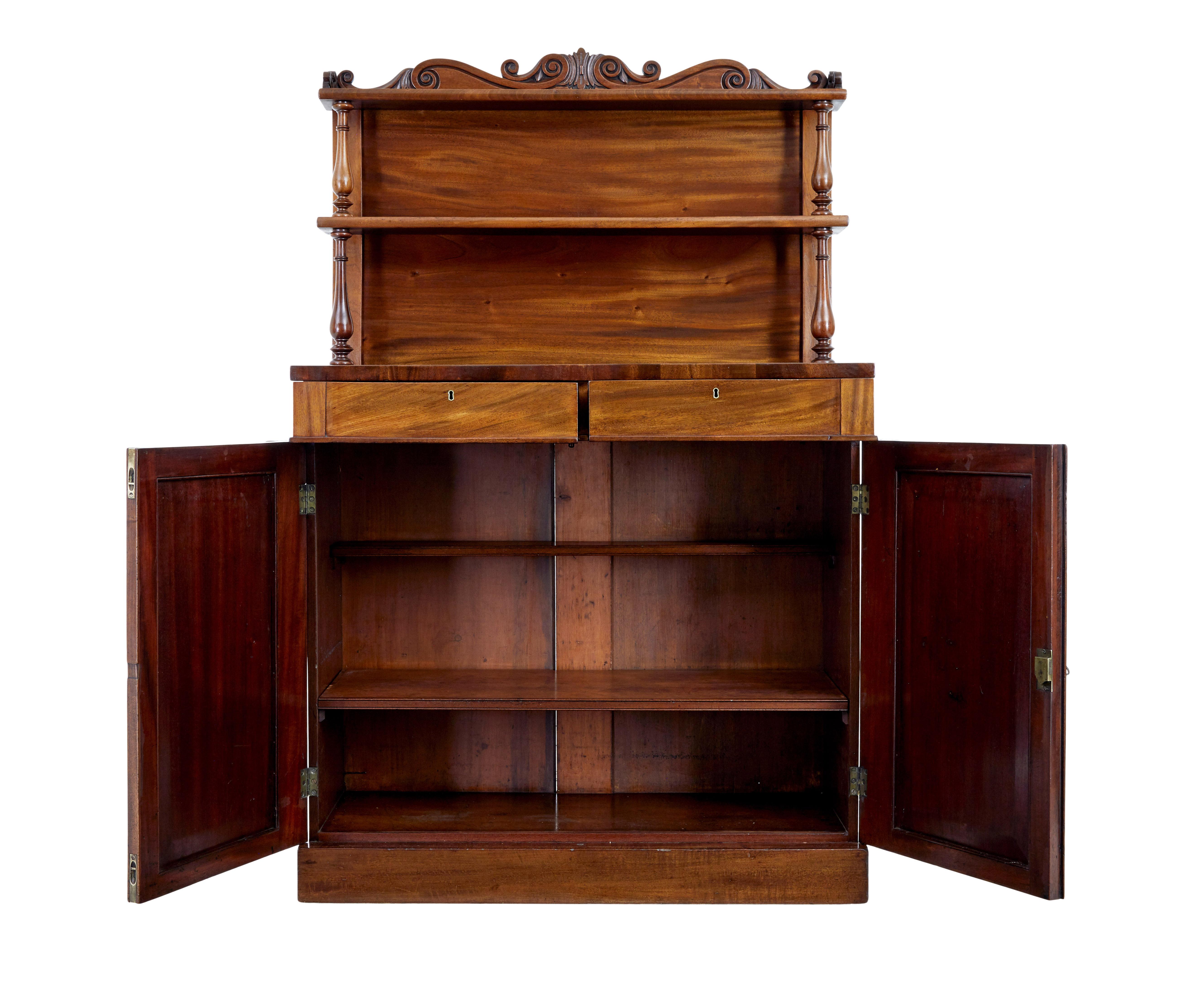 19th century French mahogany chiffonier sideboard, circa 1870.

Good quality sideboard made in rich mahogany. Top section with carved scroll gallery and 2 shelves supported by turned supports. 2 drawers below the top surface, which is veneered in a