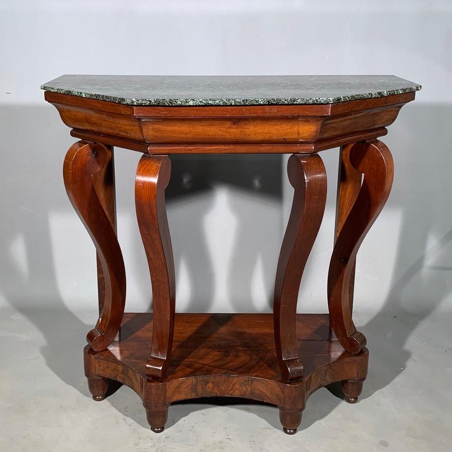 Lovely and unusual 19th century French mahogany Louis Philippe period console table four scrolling legs and an angular top. There is a central drawer to the frieze, runs well and oak lined, made with dovetails.

Good decorative piece and finished