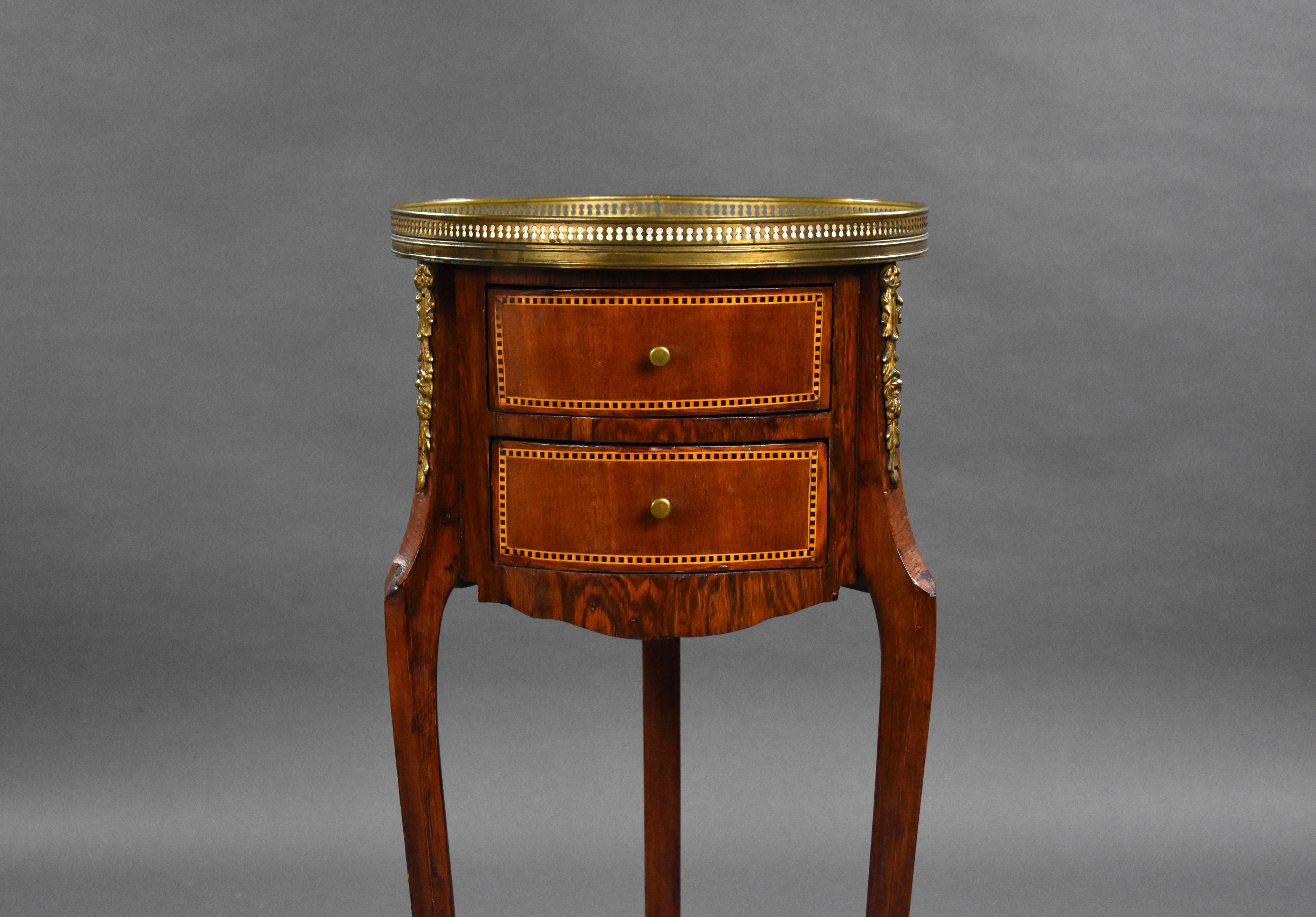 For sale is a good quality 19th century French parquetry inlaid cylinder side table, with a pierced brass gallery and a marble top, above two frieze drawers on brass mounted slender tripod supports. 

Measures: Width: 36cm Depth: 36cm Height: 77cm.