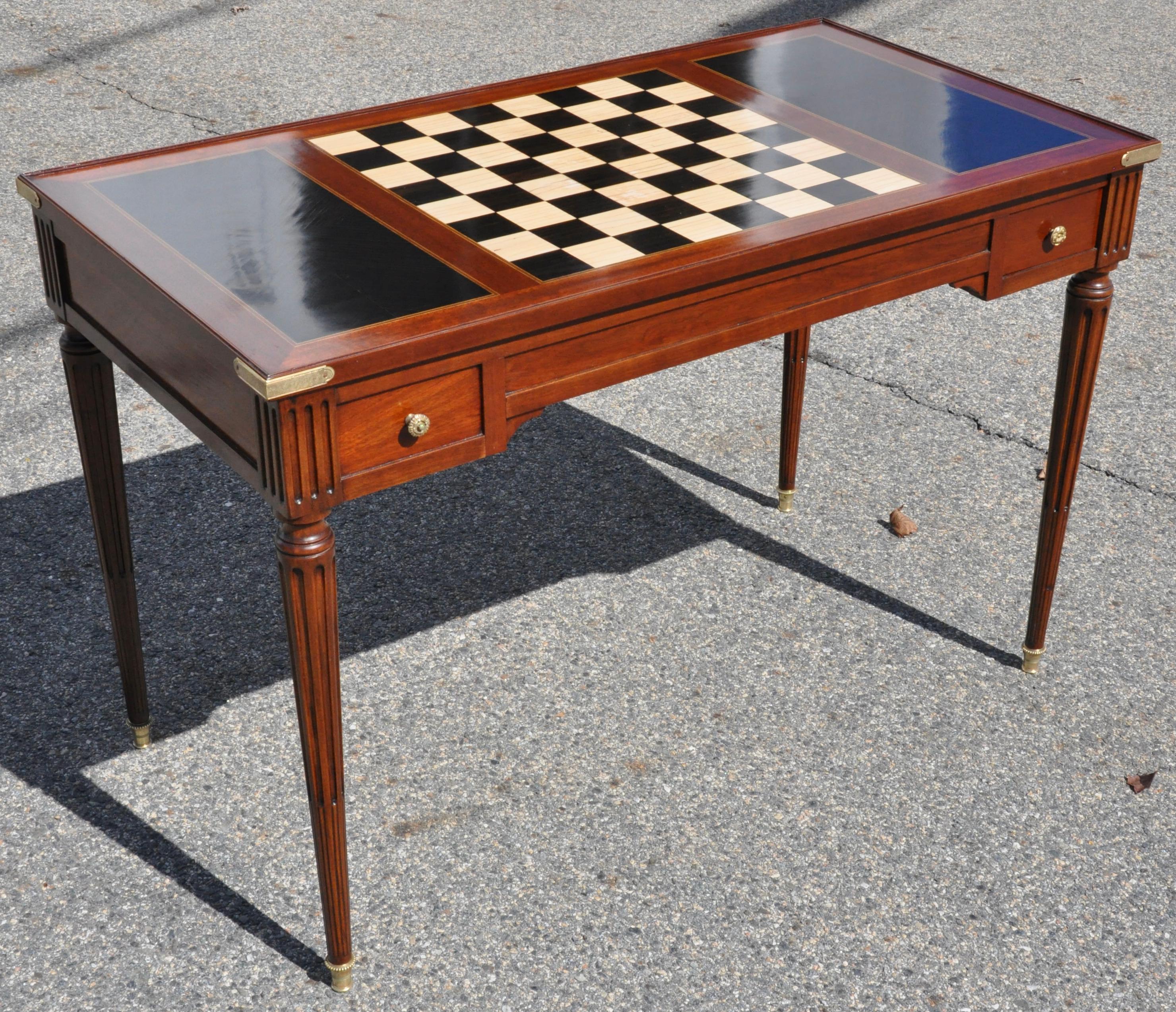 Early 19th century French mahogany Tric Trac or backgammon game table. Mahogany and ebony case with ebony and bone inlaid backgammon well. Exquisite top with bone and ebony chess or checkerboard. Reverse of top is leather covered for use as a