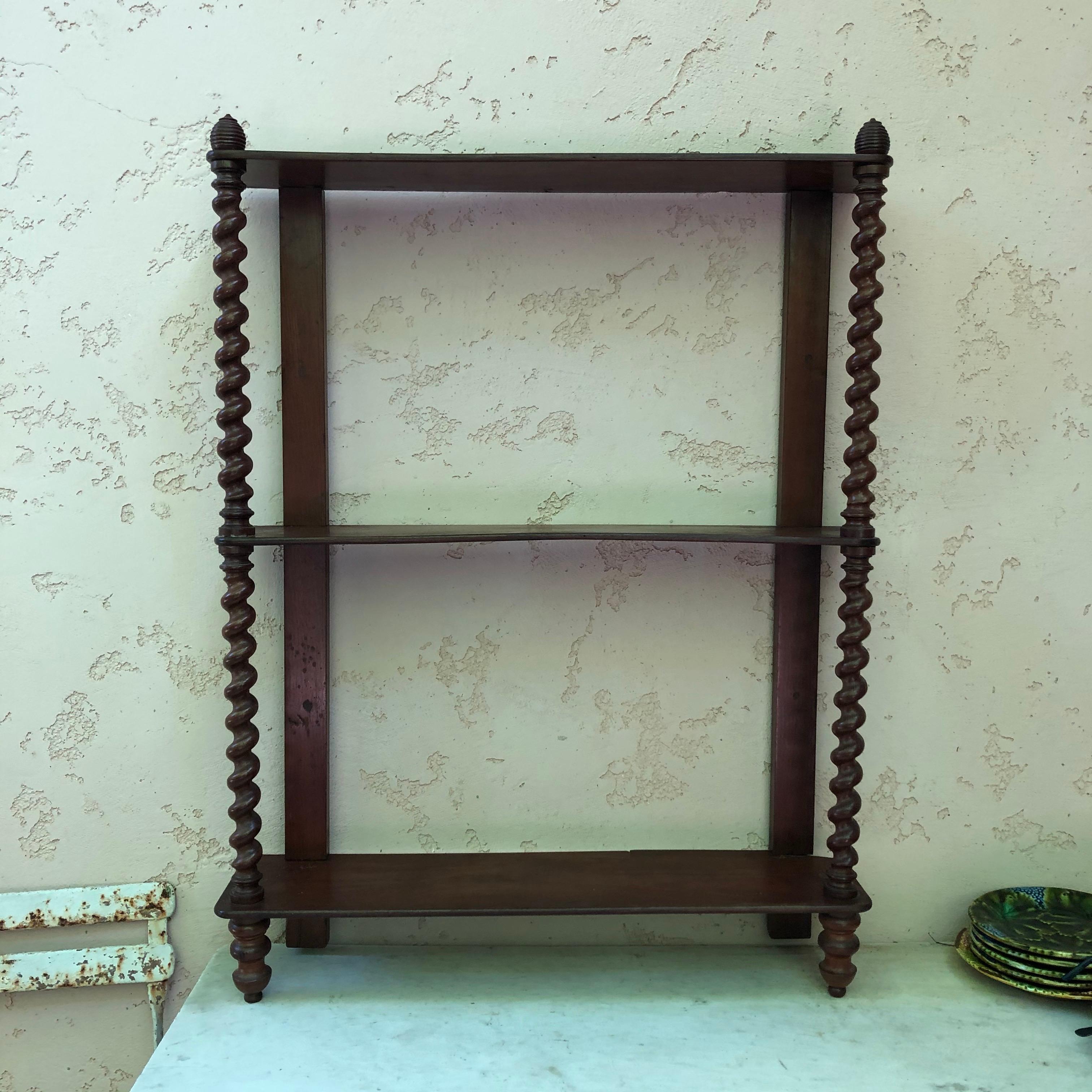 19th century French mahogany wood shelf with twisted column.
     