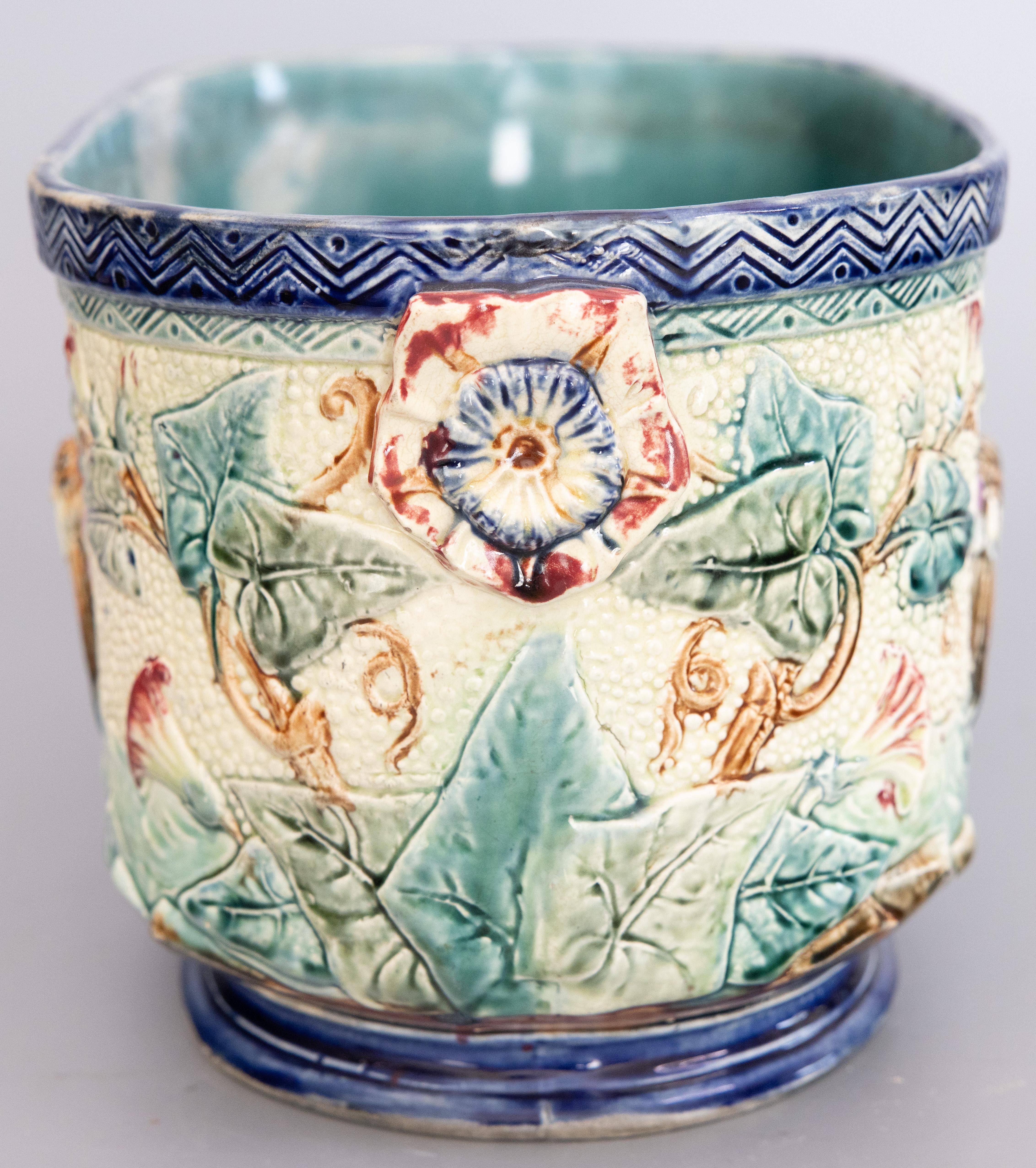 A lovely antique French majolica jardiniere / cachepot / planter, circa 1880. Maker's mark on reverse. This fine jardiniere is a nice large size with a drainage hole, hand painted with birds and a foliate design in gorgeous colors.

DIMENSIONS
16ʺW