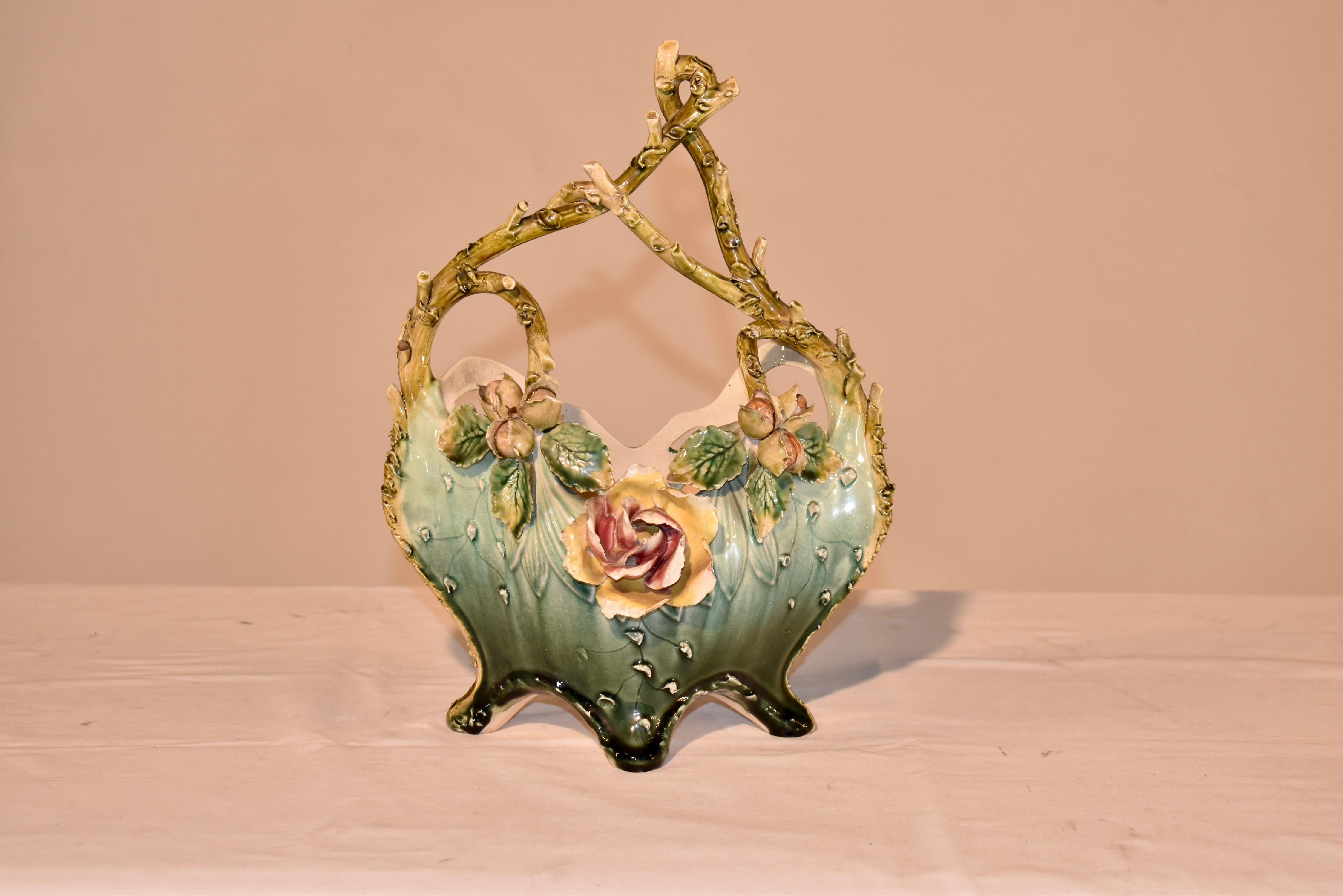 19th century French majolica basket with the most gorgeous twig handles we have had the pleasure to see!  The handles miraculously have no damage, just a firing crack at the very top where the handle bends, as is pictured.  The twig handles go along
