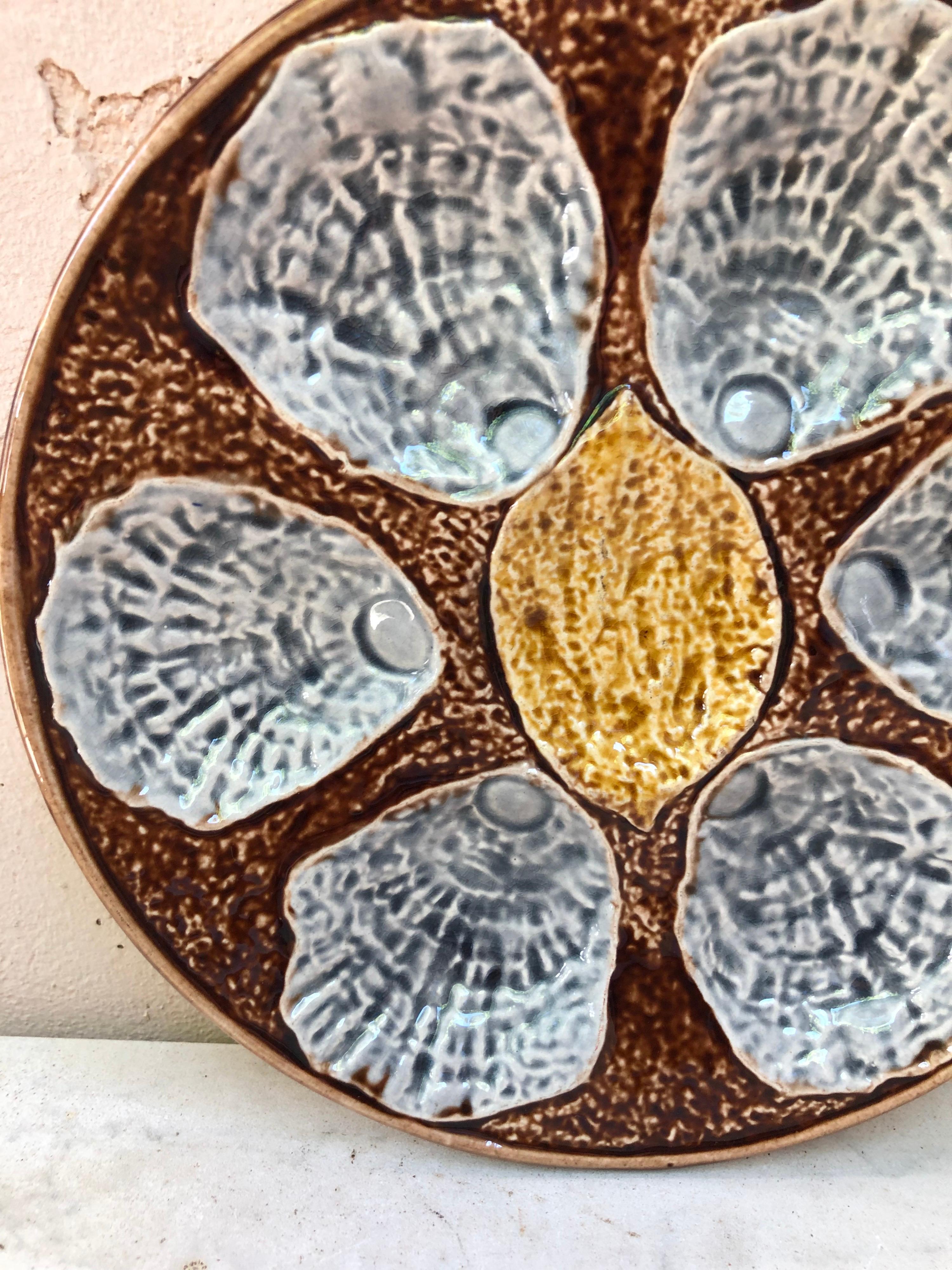 19th century French Majolica Oyster plate unsigned, with a lemon on the center.