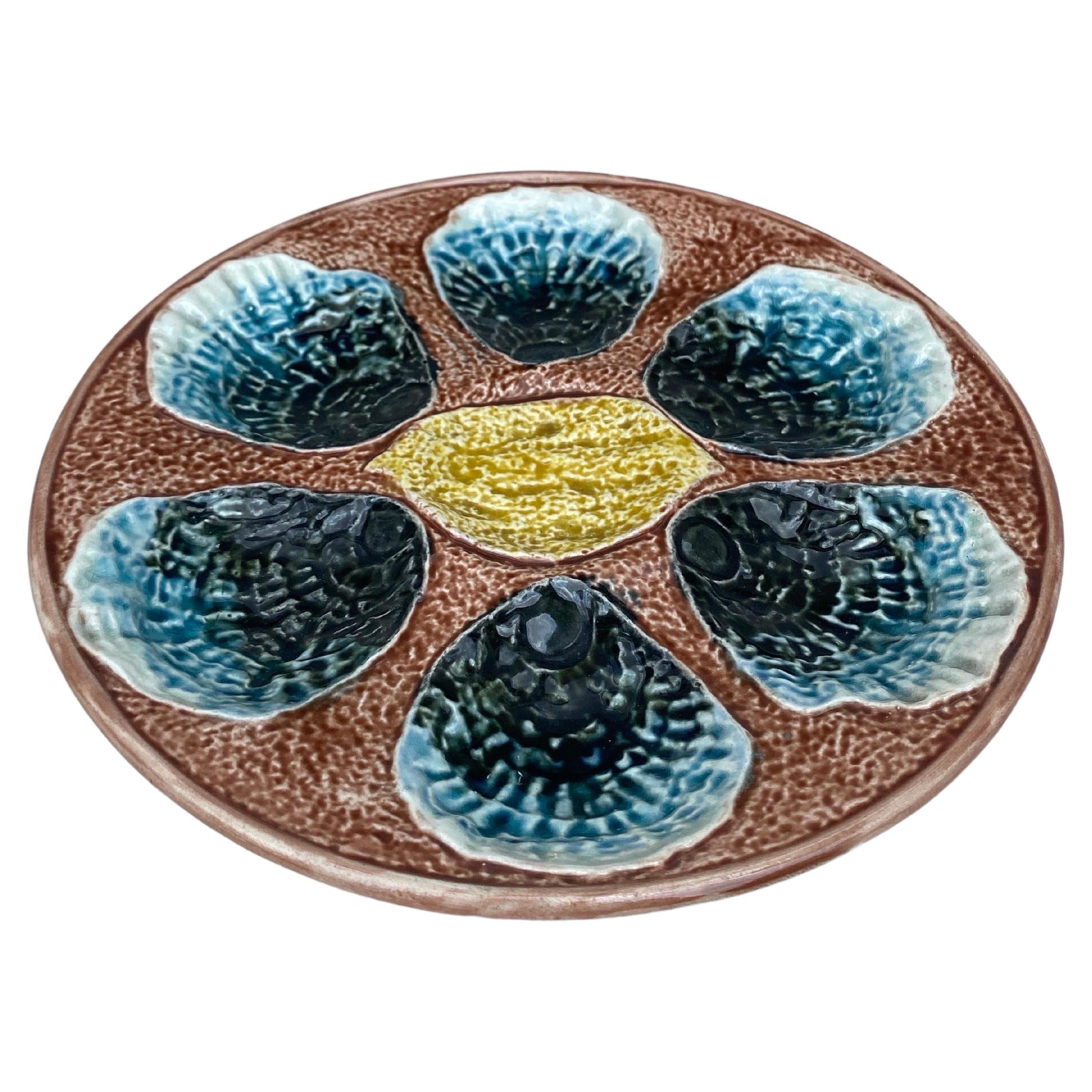 19th century French Majolica Oyster plate unsigned, with a lemon on the center.