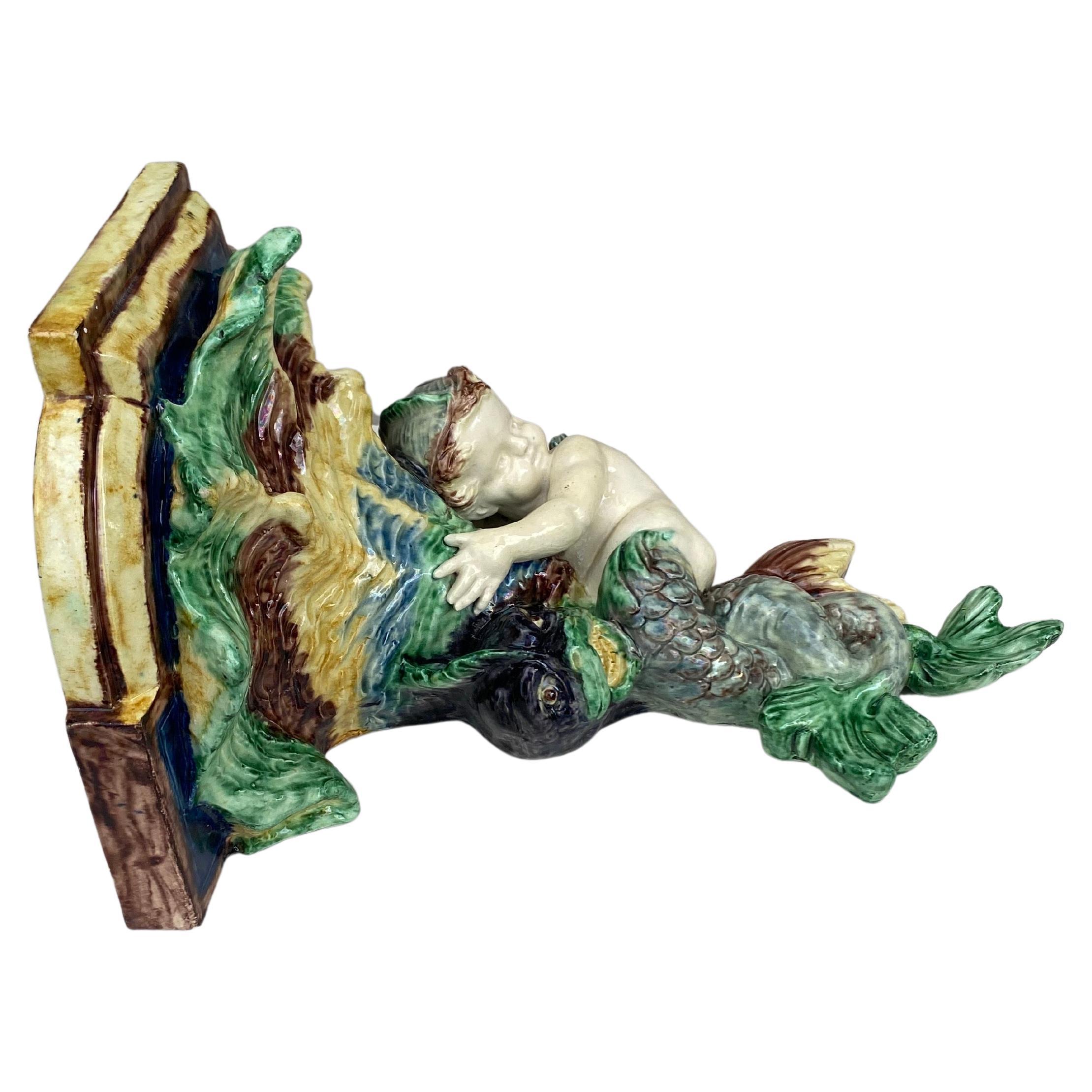 Large 19th Century French Majolica Palissy wall bracket shelf with Putti Merman.
Thomas Sergent unsigned.
Height / 11.5 inches.