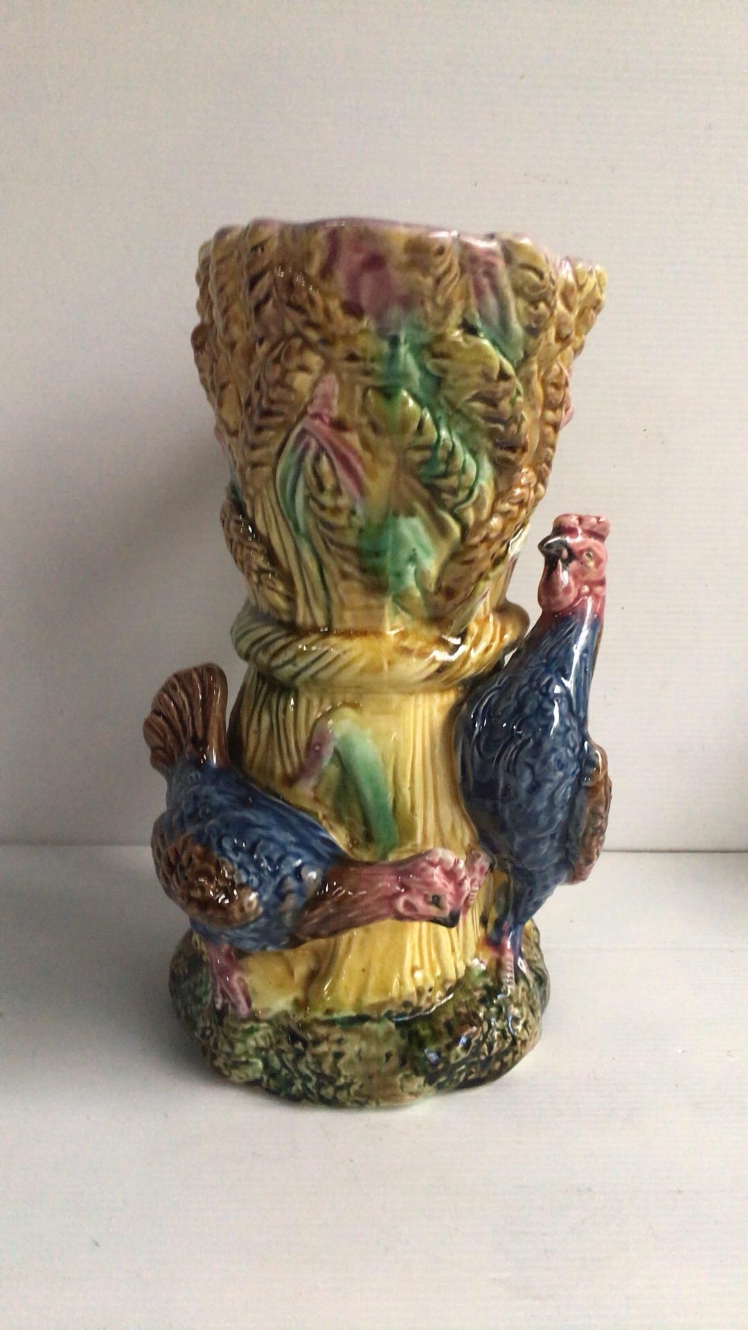 French Majolica rooster and hen pitcher on a wheat and field flowers background, circa 1880.
H 10,5