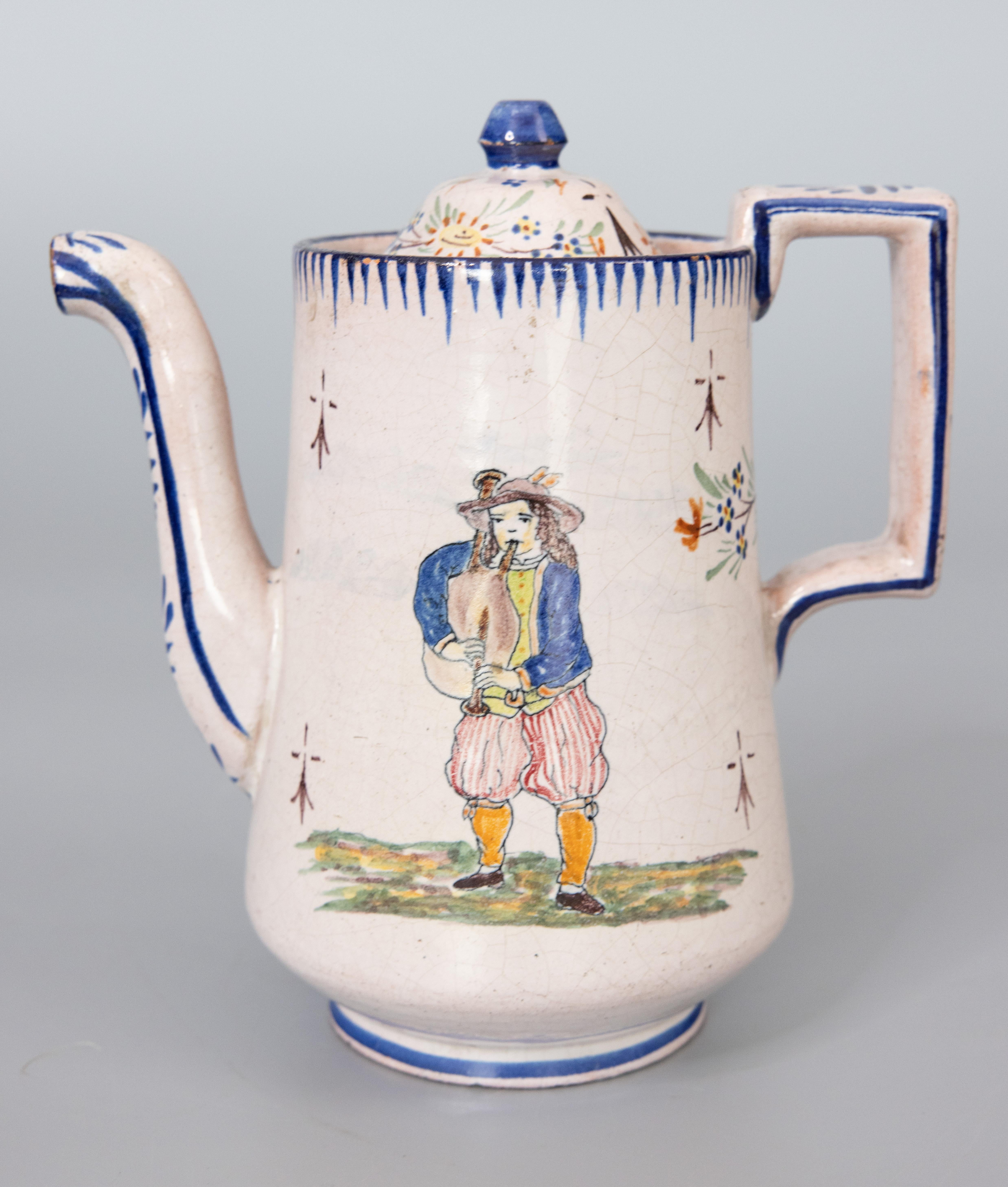 A superb antique French provincial Malicorne faience teapot from Pouplard-Beatrix, circa 1890. Signed PBx on reverse. This charming tea pot depicts a young Breton woman carrying a basket and umbrella and the opposite side depicts a young Breton man