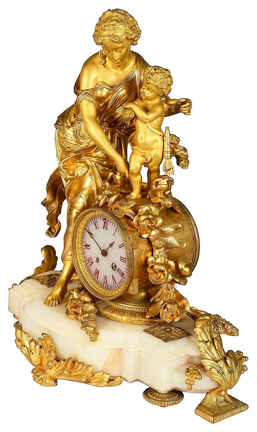 Gilt 19th Century French marble and ormolu clock garniture. For Sale