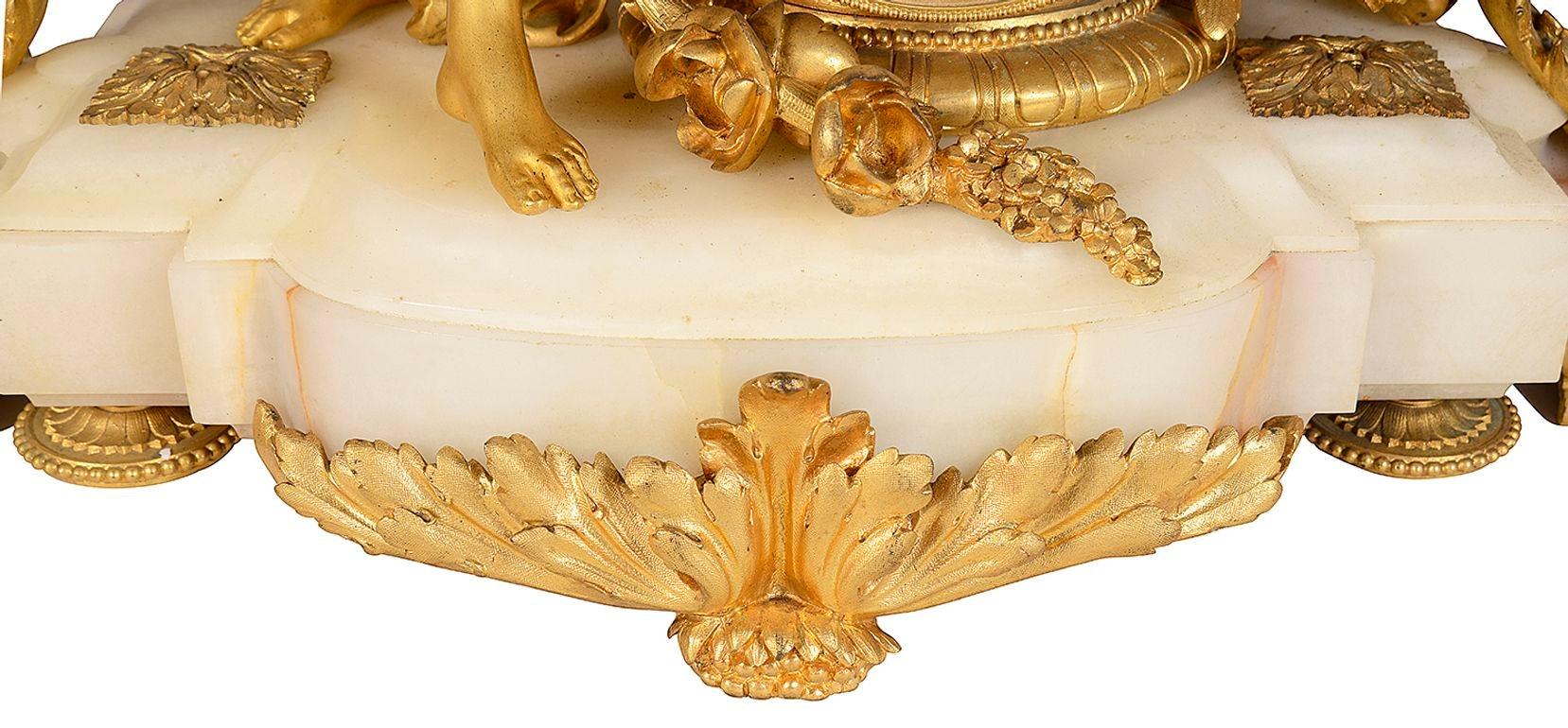 19th Century French marble and ormolu clock garniture. For Sale 2