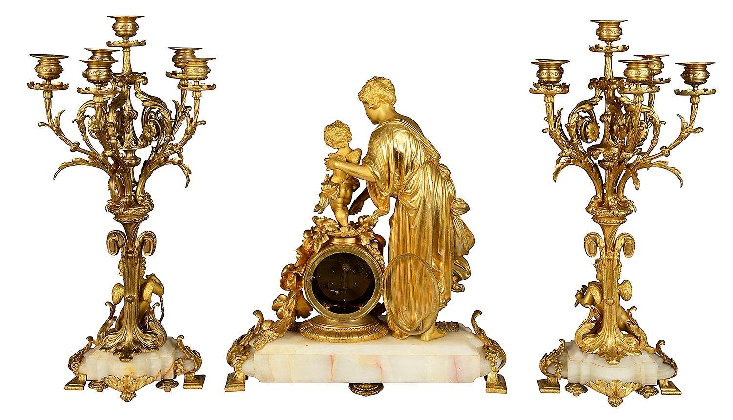 19th Century French marble and ormolu clock garniture. For Sale 3