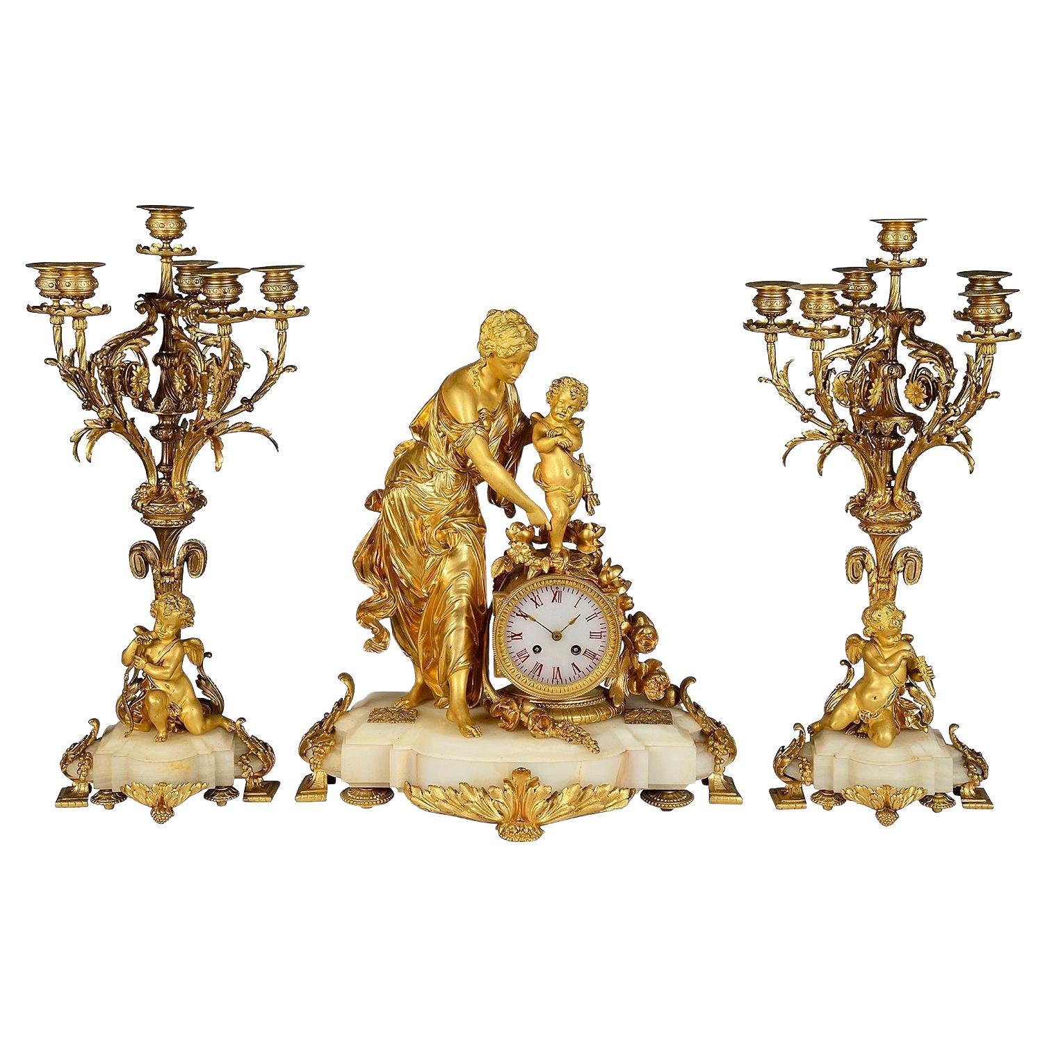 19th Century French marble and ormolu clock garniture. For Sale