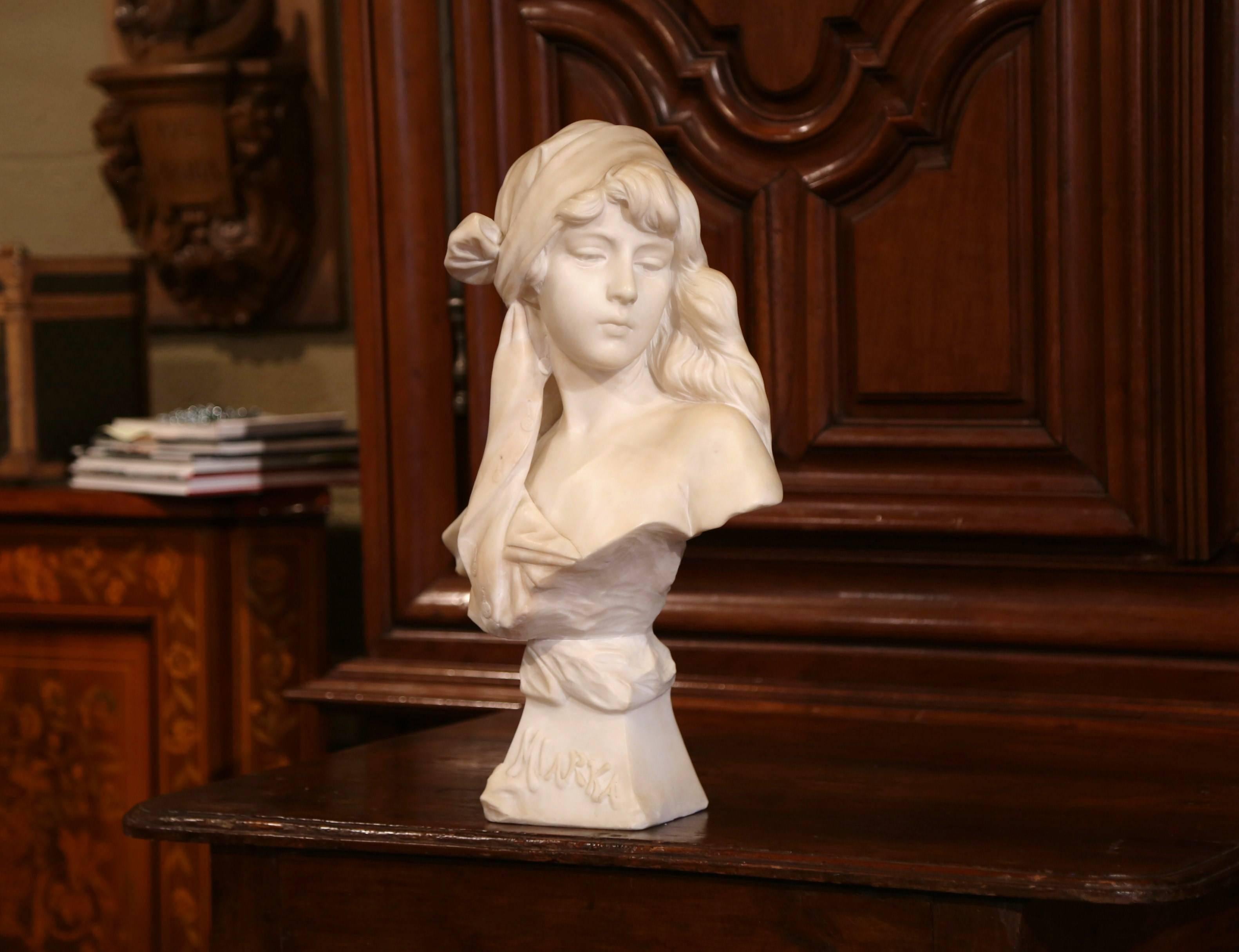 Place this elegant antique sculpture on a console or a pedestal, crafted in France, circa 1880, the white carved bust features a beautiful and young lady looking on the side. Titled 